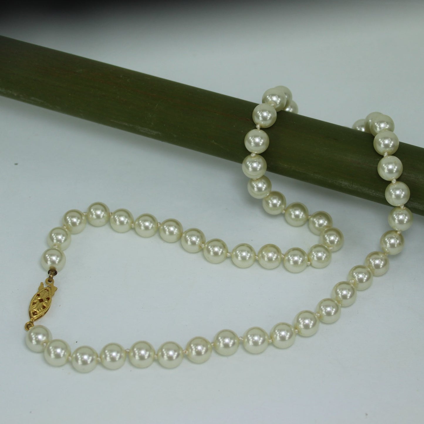 Classic Pearl Necklace Princess Length 18" Knotted 7.5mm Luminous Pearls table view
