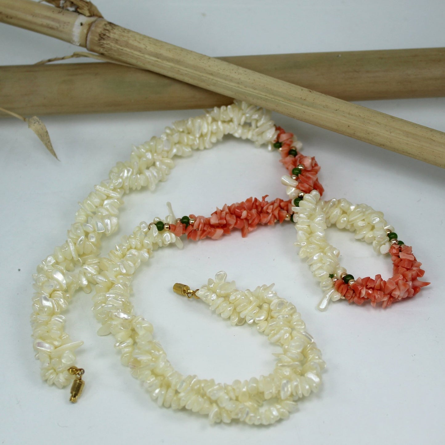 Elegant Twisted 3 Strand Pearl Shell Coral Jade Necklace 1970s Vintage table view