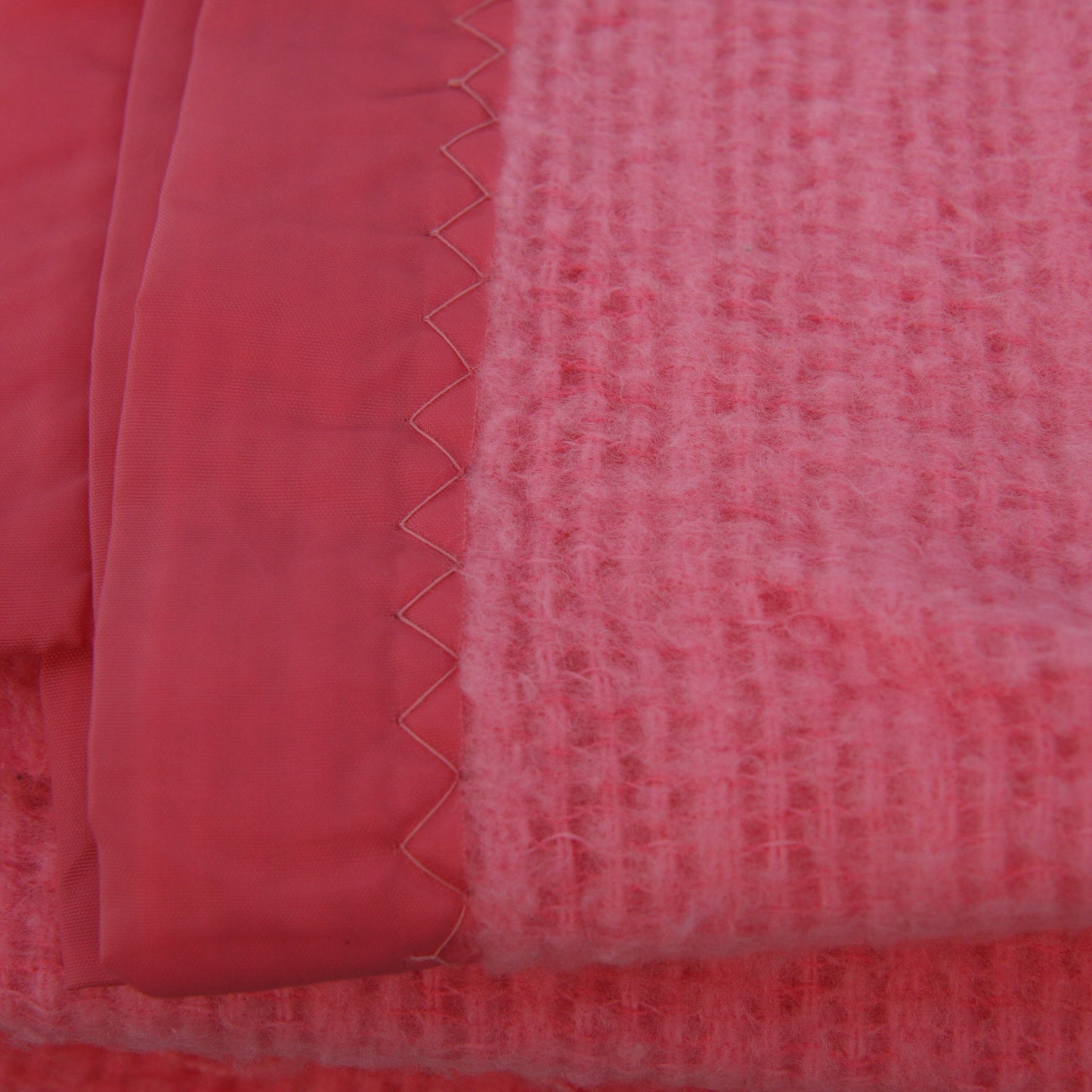 close up of pink acrylic blanket binding and stitching