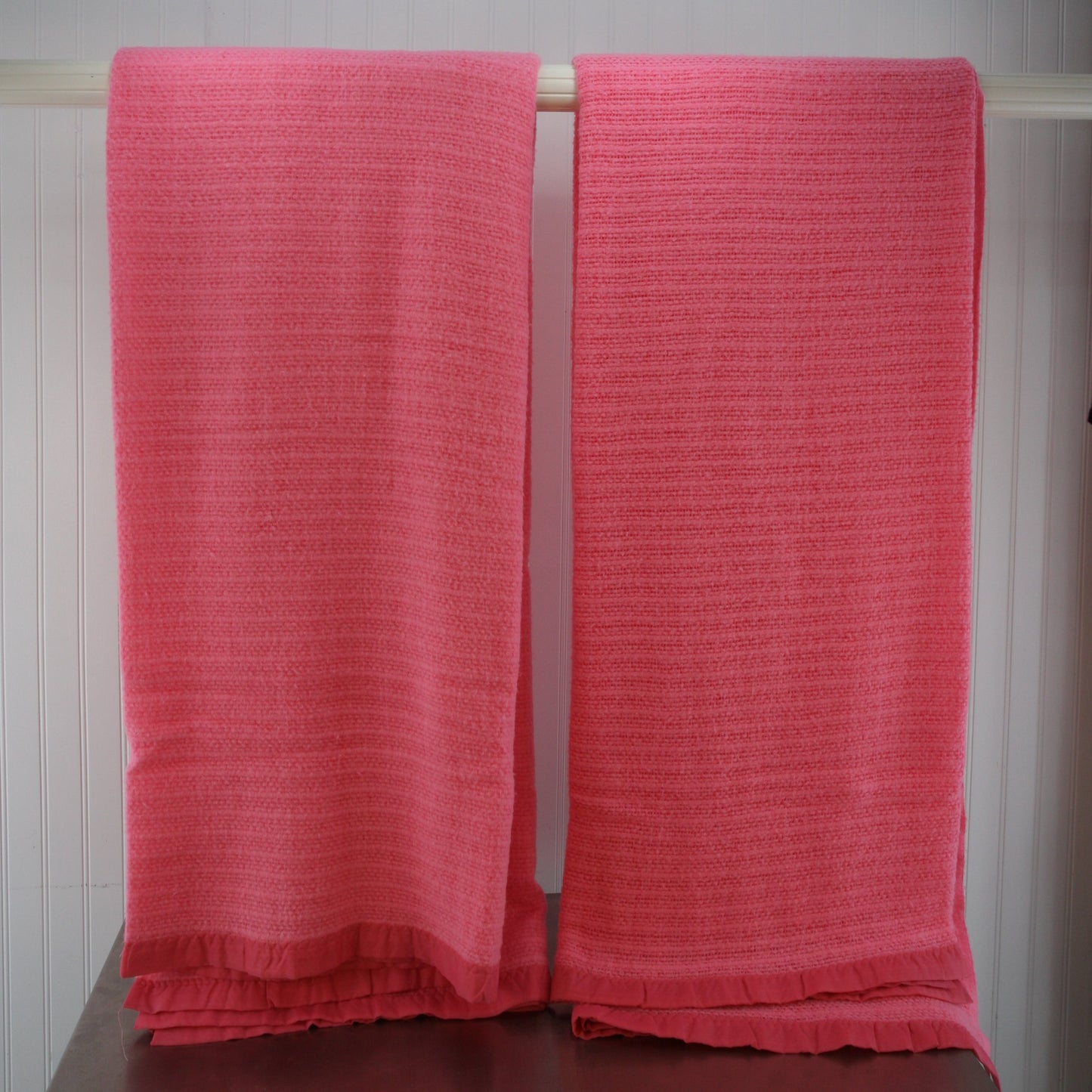 full length of two pink acrylic blankets