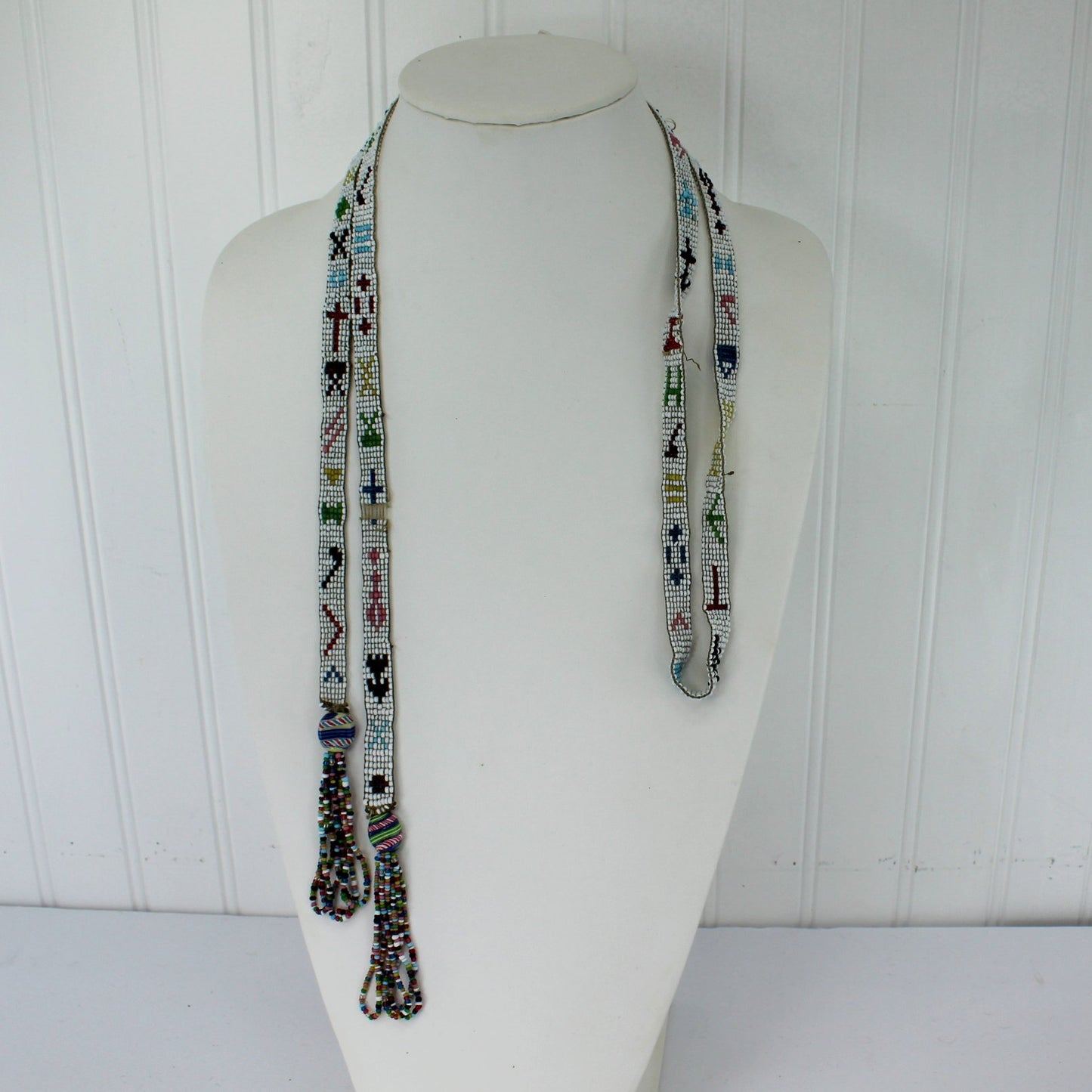 Estate Southwest Native Ceremonial Beaded Tassle Necklace 55" Vintage showing size on neck form