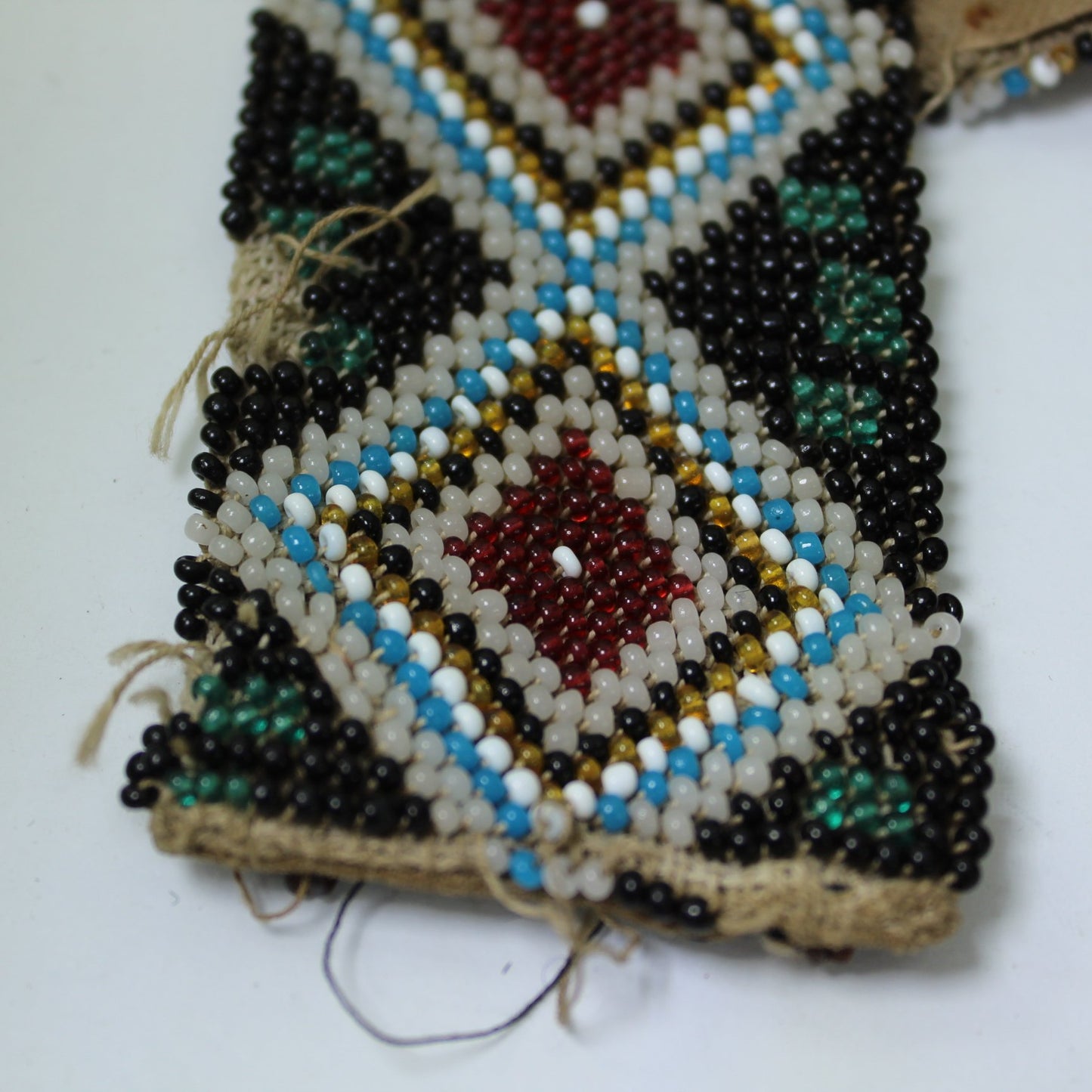 Antique Victorian Era Bead Belt Diamond Design Estate Native American very close view of end with fibers