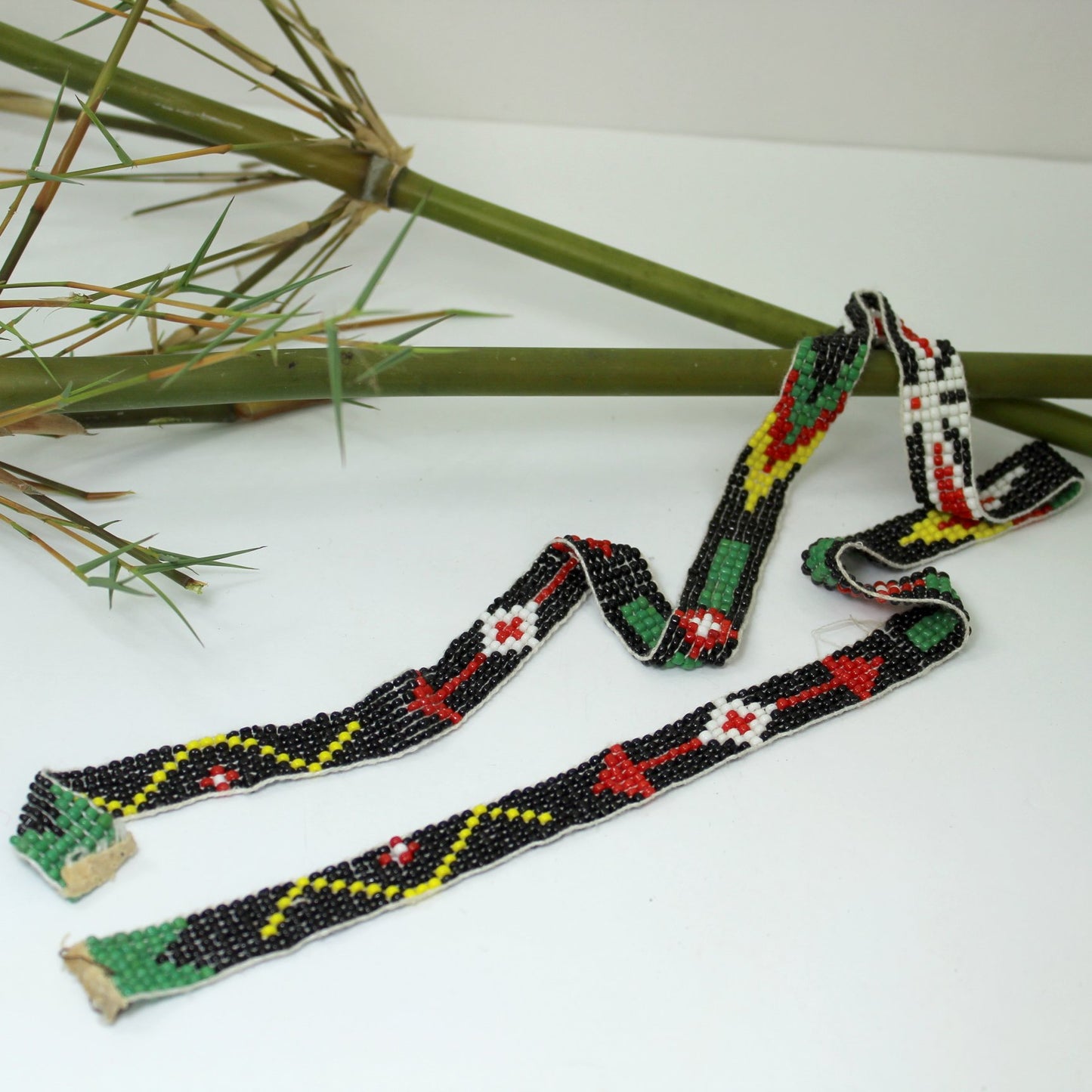 Estate Southwest Native Beaded Thunderbird Necklace Hat 26" Vintage showing length and end fabric