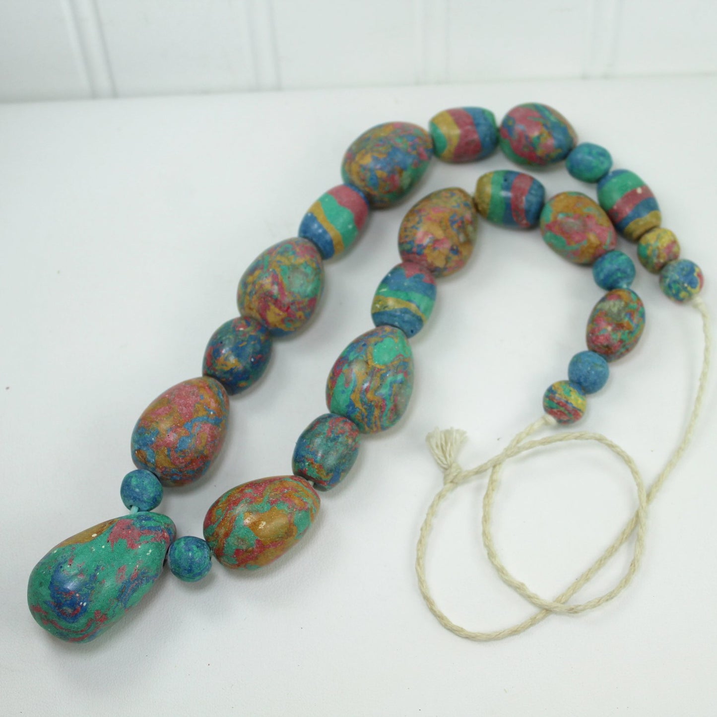 Strand Necklace Large Pastel Clay Hand Made Beads Marbleized Patterns Africa closeup flat view