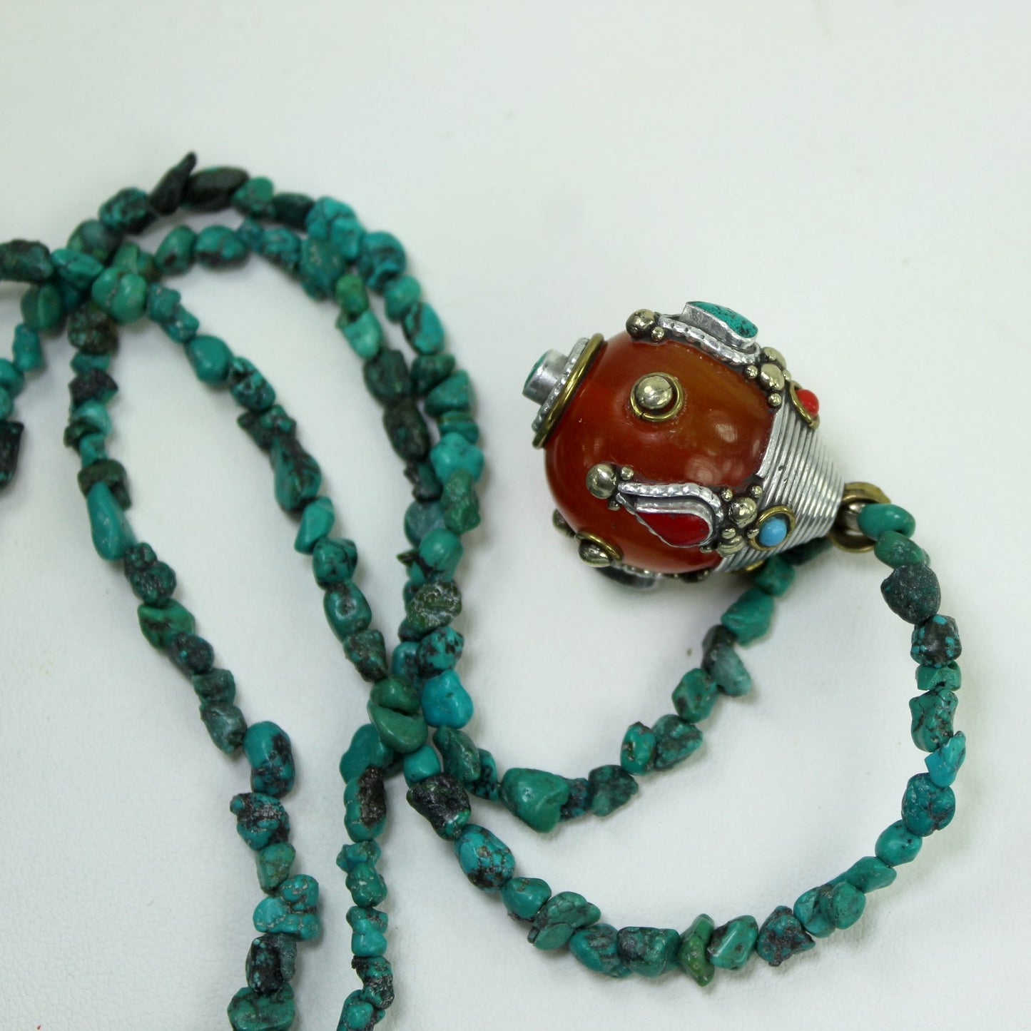Turquoise Nugget Necklace Amber Color Bauble Pendant Turquoise Coral closeup pendant