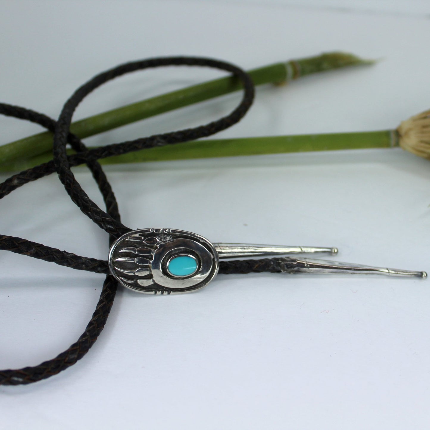 Navajo Vintage Bolo Silver Turquoise 1950s 60s Bennett Clasp Fine Oval Bear Claw Design Estate closeup side view slide tips