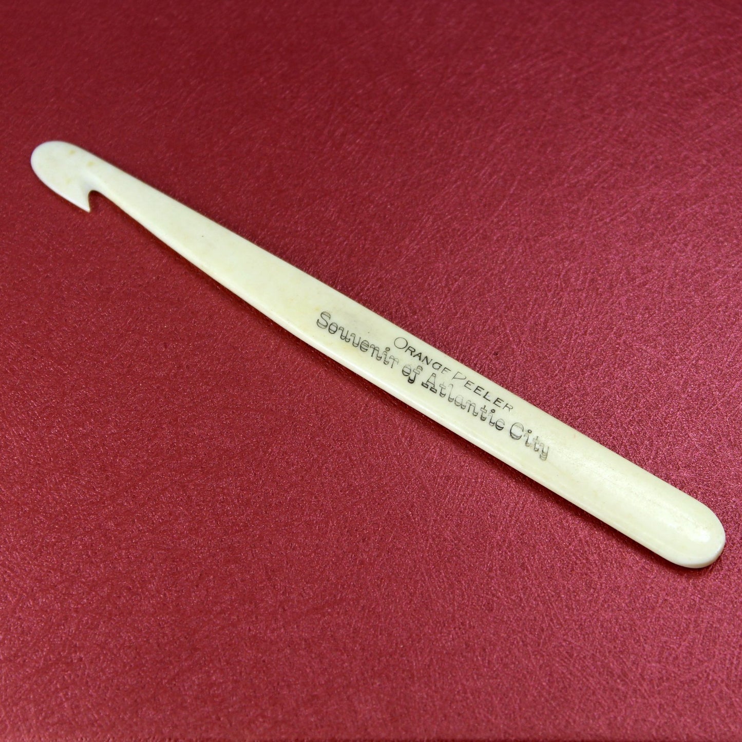 Vintage Souvenir Orange Peeler Atlantic City Painted Bone Japan full view reverse peeler