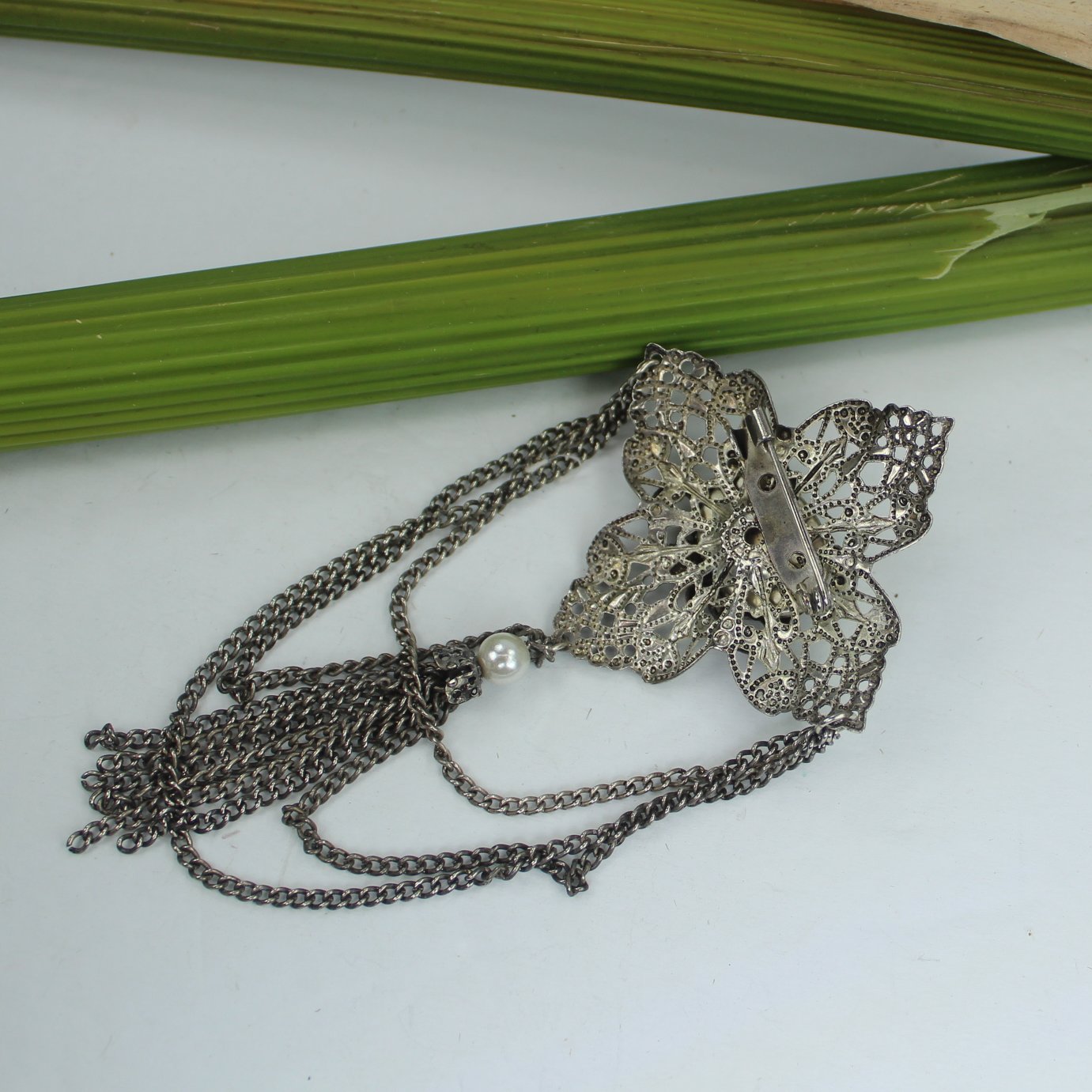 1928 Jewelry Company Filigree Pin Onyx Pearl Chains reverse view