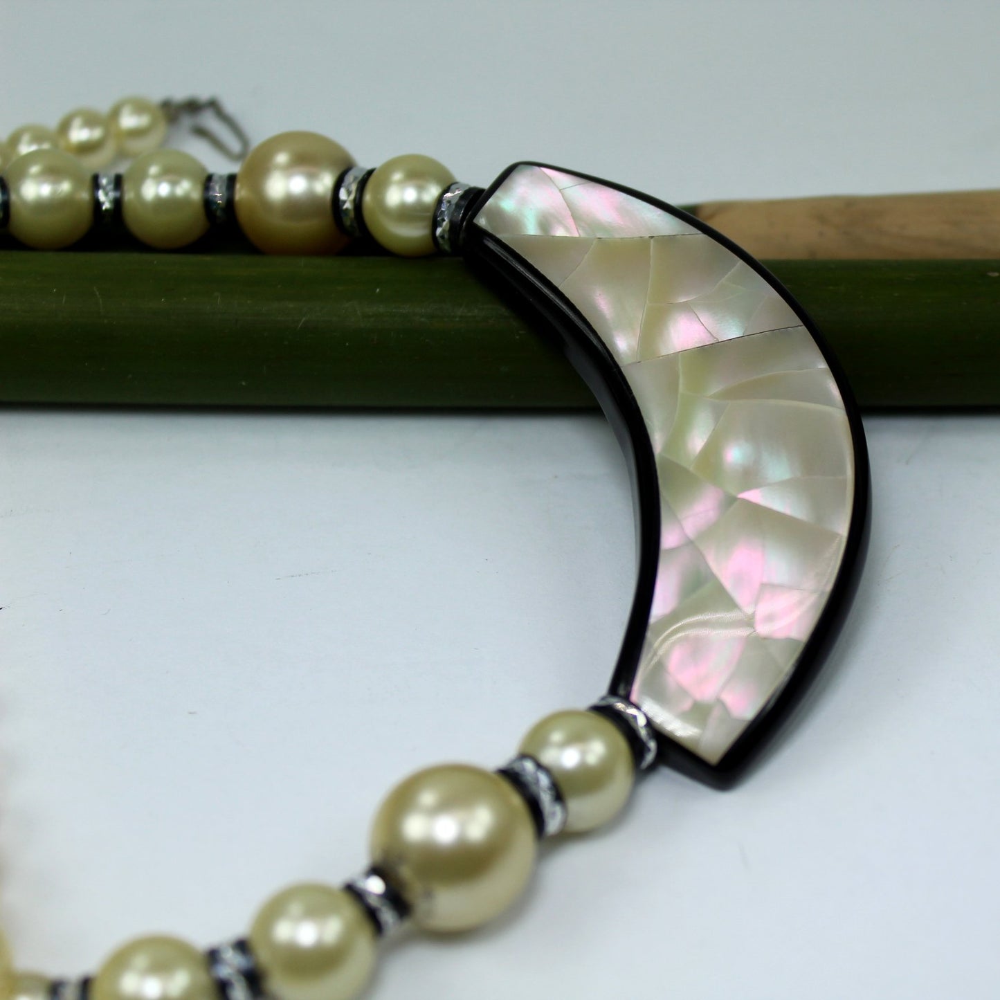 Unusual Necklace Mother of Pearl On Black Crescent Pearl Chain Black Accents closeup view