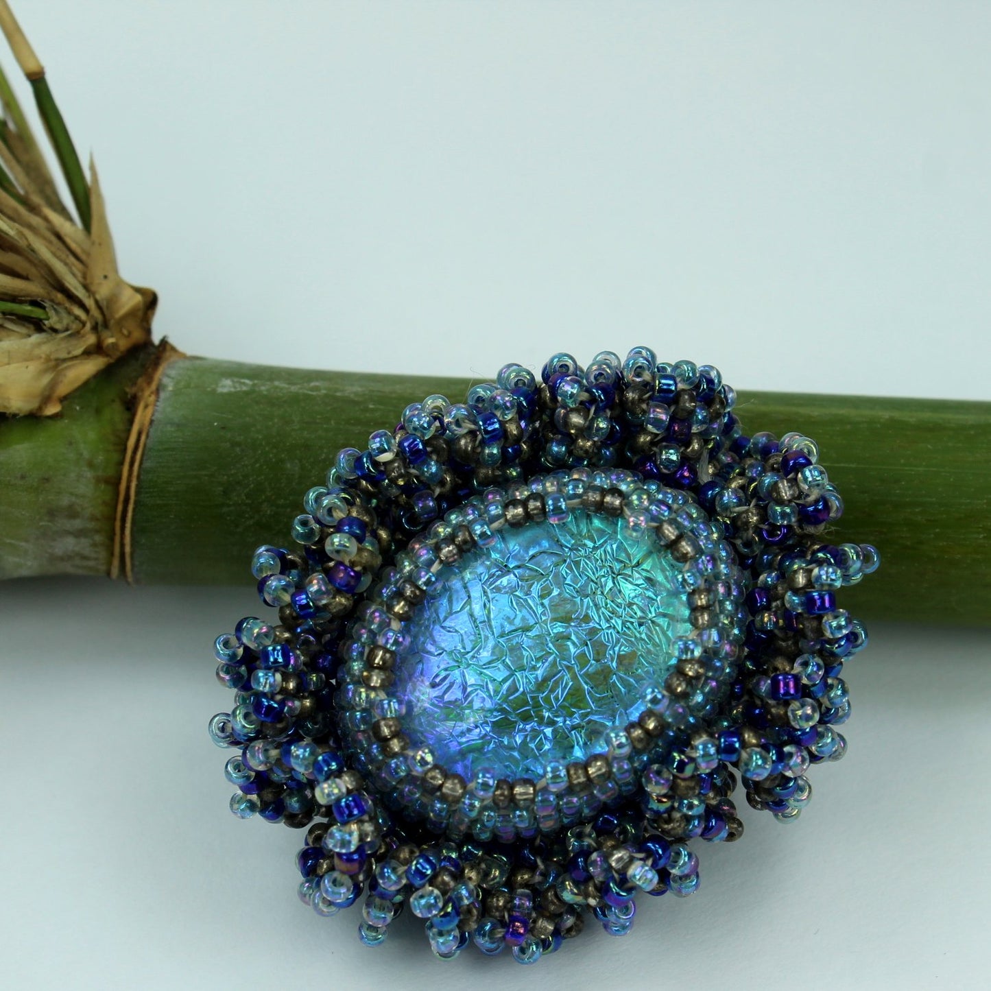 Pat Falk Early Work Glass Pin Iridescent Bead Ruffle Surround Brilliant Blues
