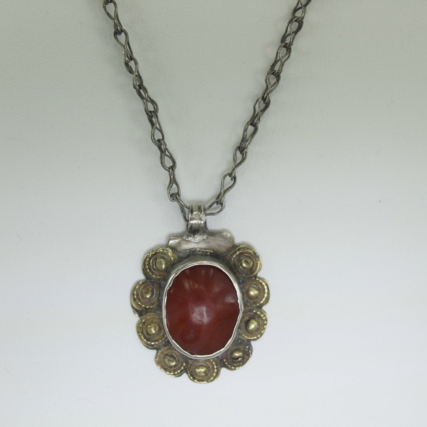 African Necklace Cinnabar Multi Metals Composite Framed Stone Hand Made closeup of pendant