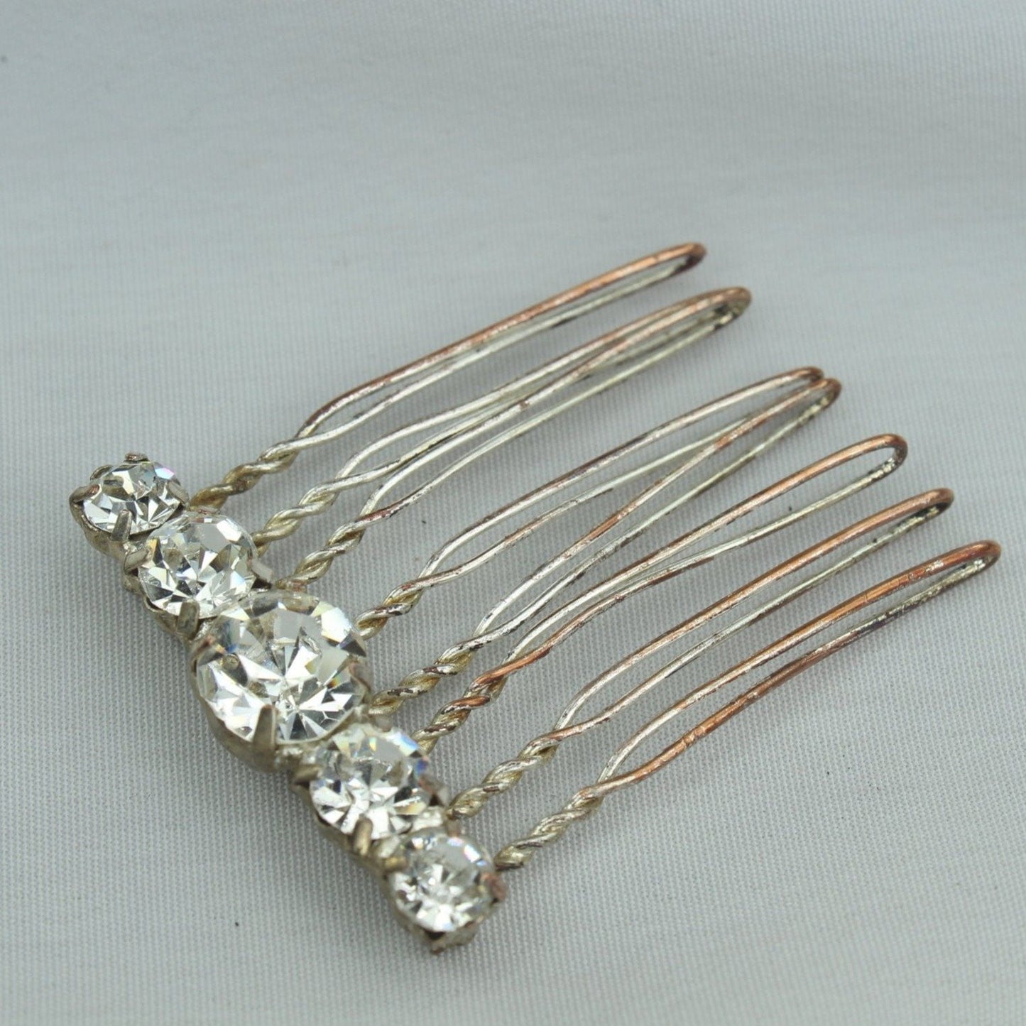 Neat Vintage Antique Hair Pin Decoration. Metal hair pin like base with large shiny Rhinestones. Metal shows vintage Stones great! Fun piece.