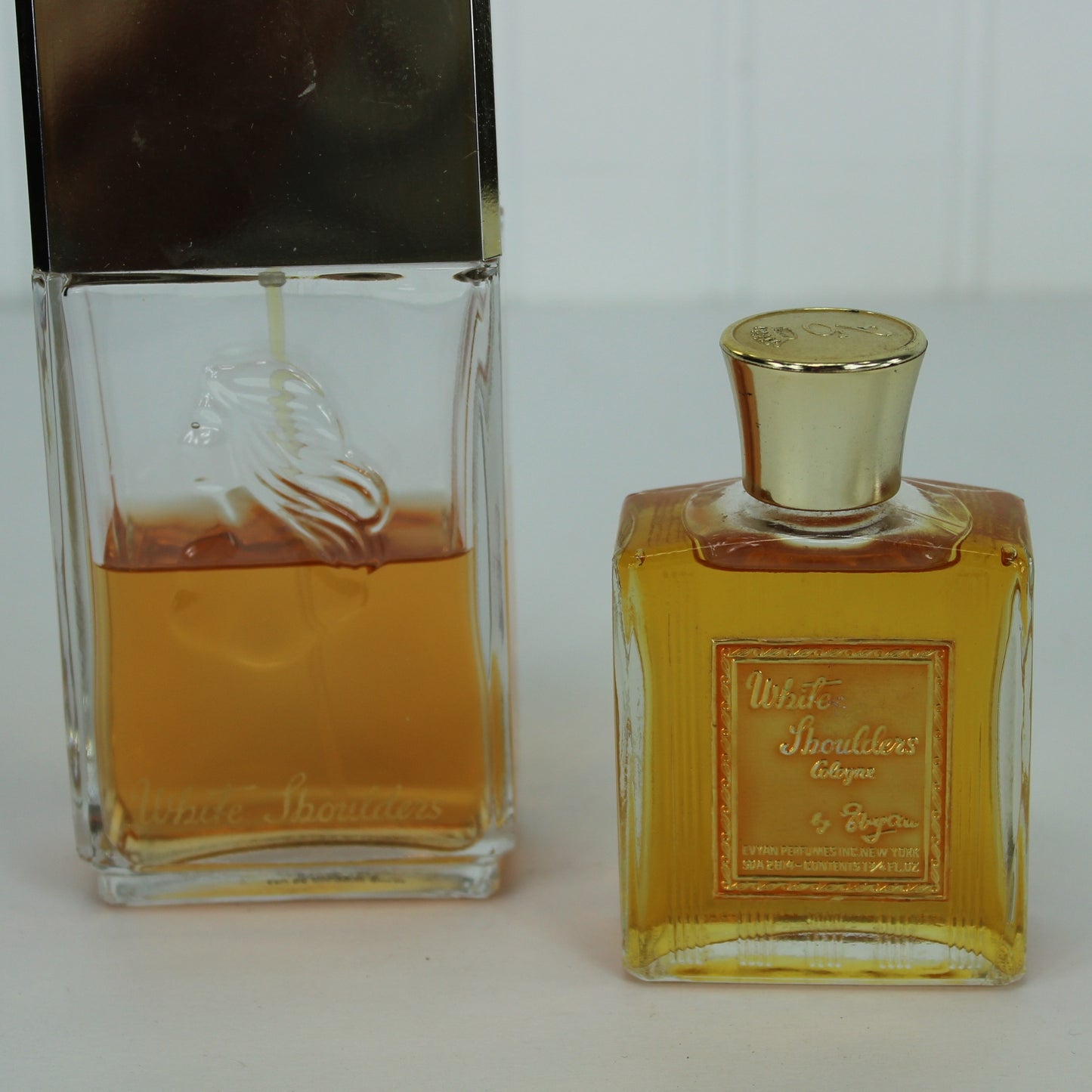 White Shoulders Evyan 2 Vintage Bottles 4.5 oz Spray 1 3/4 oz Cologne bottles nice condition