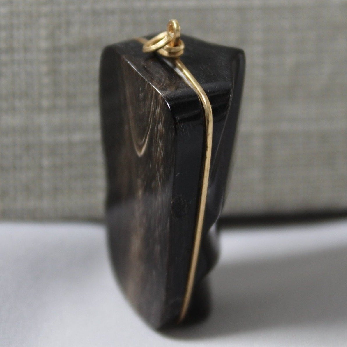 Artisan Mask Pendant - Black Grained Stone Gold Color Wire Wrap Side View