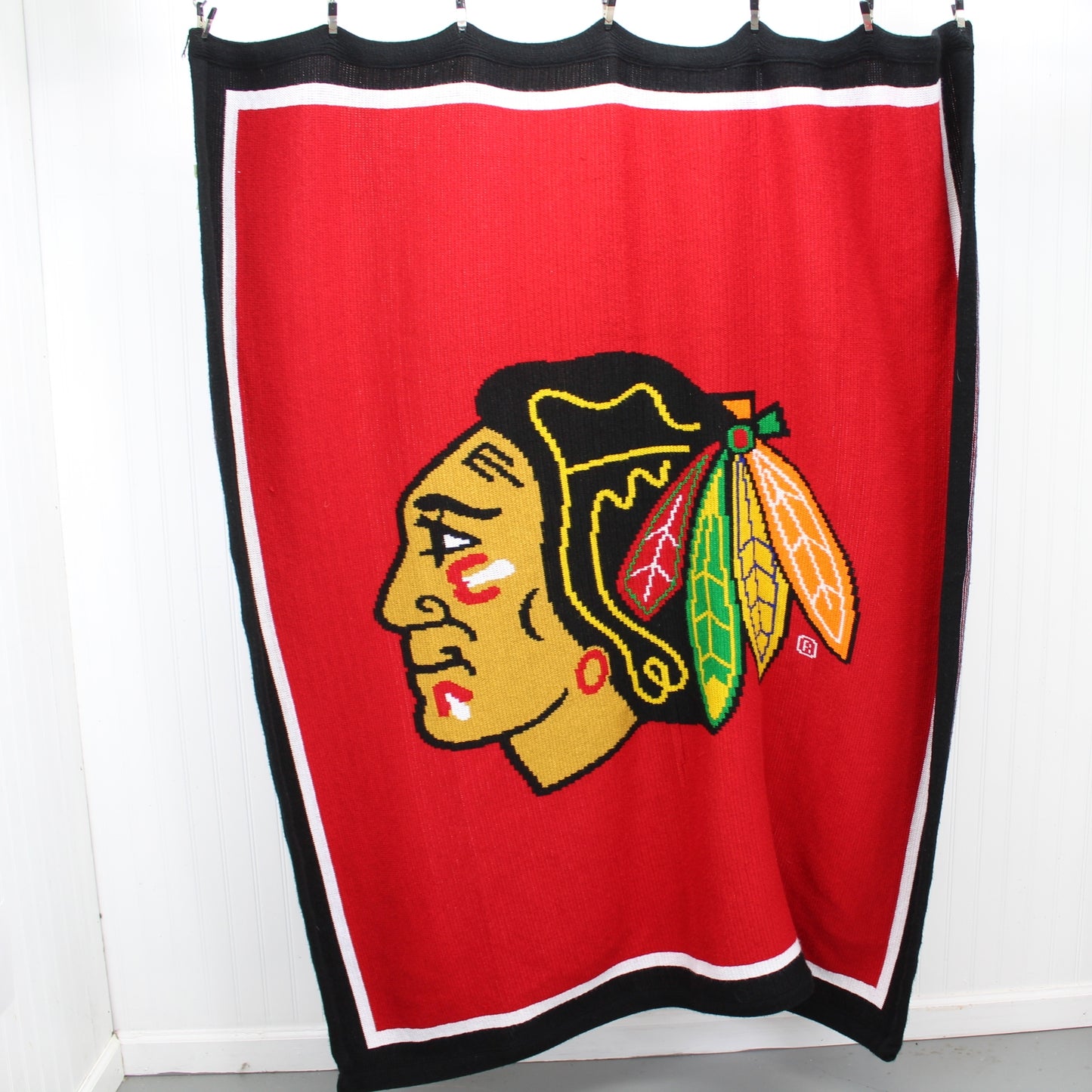 Chicago Blackhawks Jennick Knits Acrylic Sweater Knit Stadium Throw Blanket full size view of throw