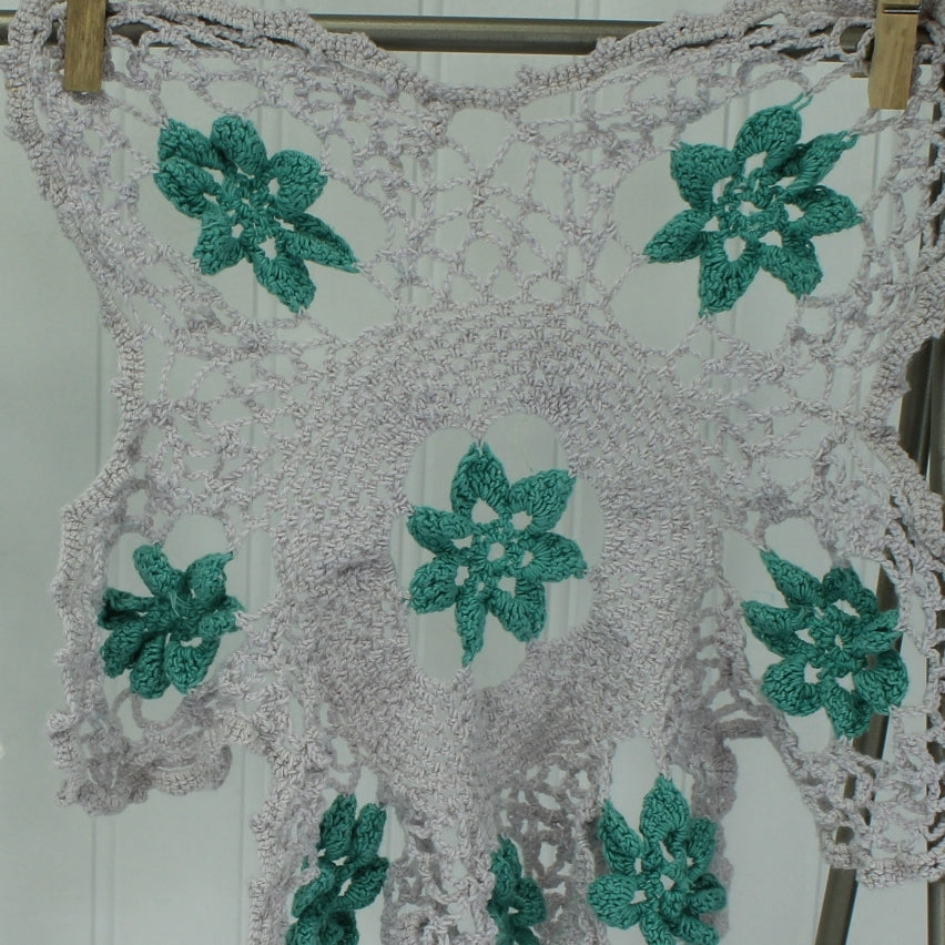 Pair Crochet Doilies Raised Dimensional Flowers Grey Aqua and Blue on White closeup o f grey doily