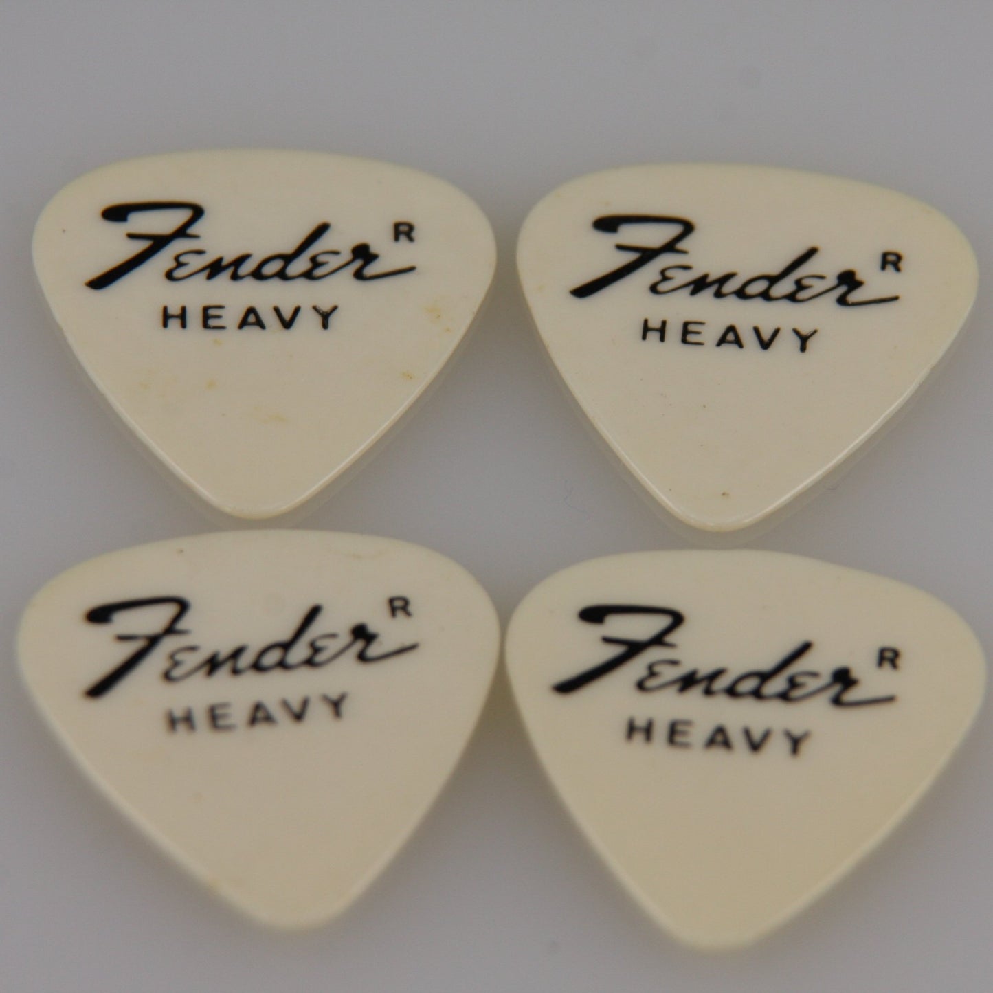 Lot of Four Vintage Guitar Picks White Fender Heavy from Roadie Stash