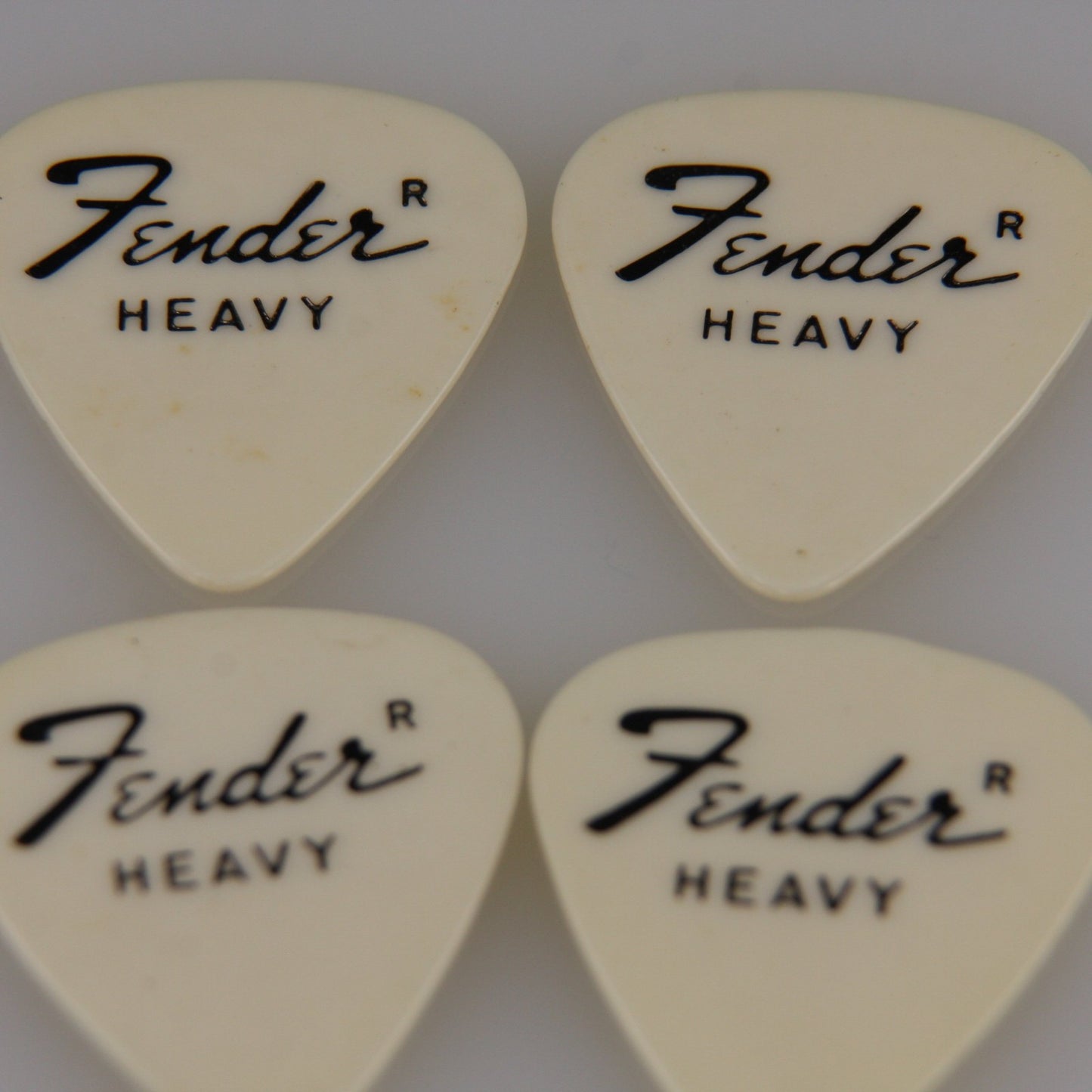 Lot of Four Vintage Guitar Picks White Fender Heavy from Roadie Stash
