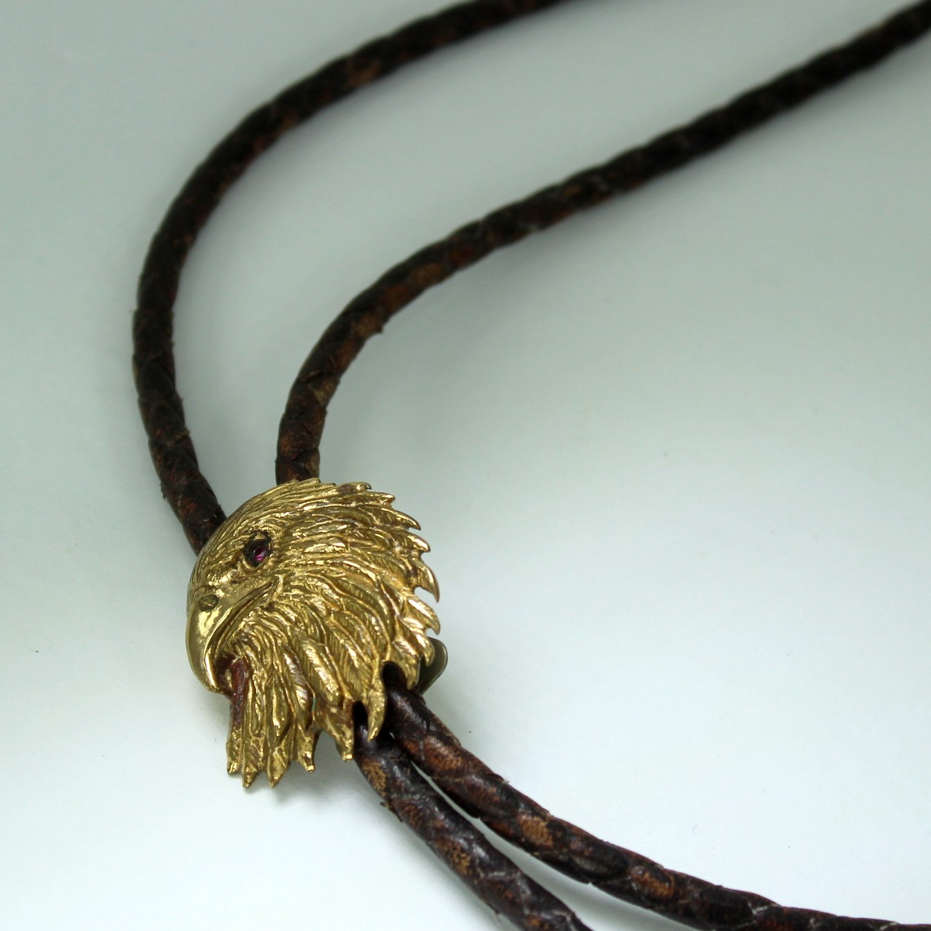 Vintage Bolo Tie Eagle Head Prong Set Crystal Eye Leather Tie Estate closeup eagle head