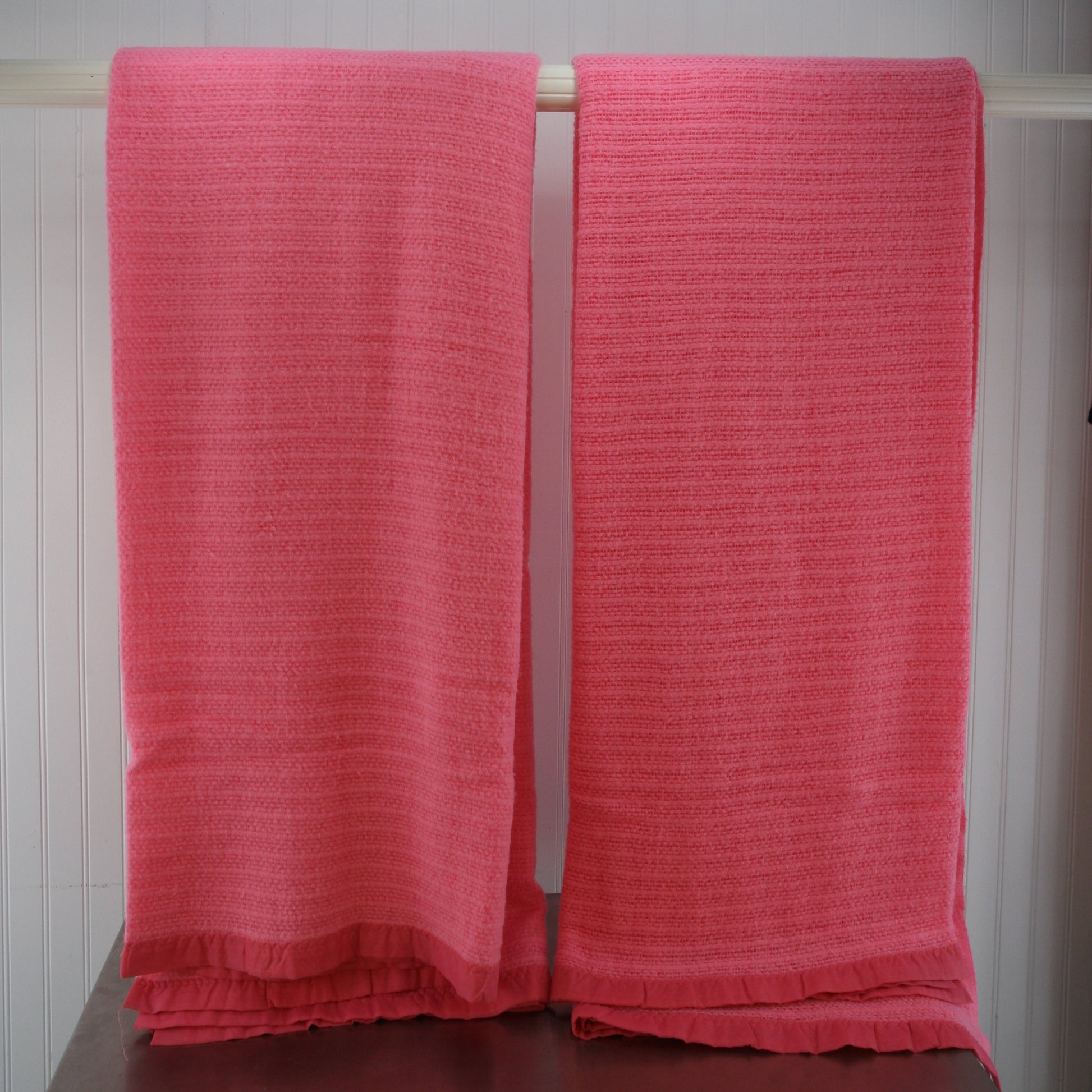 full length of two pink acrylic blankets