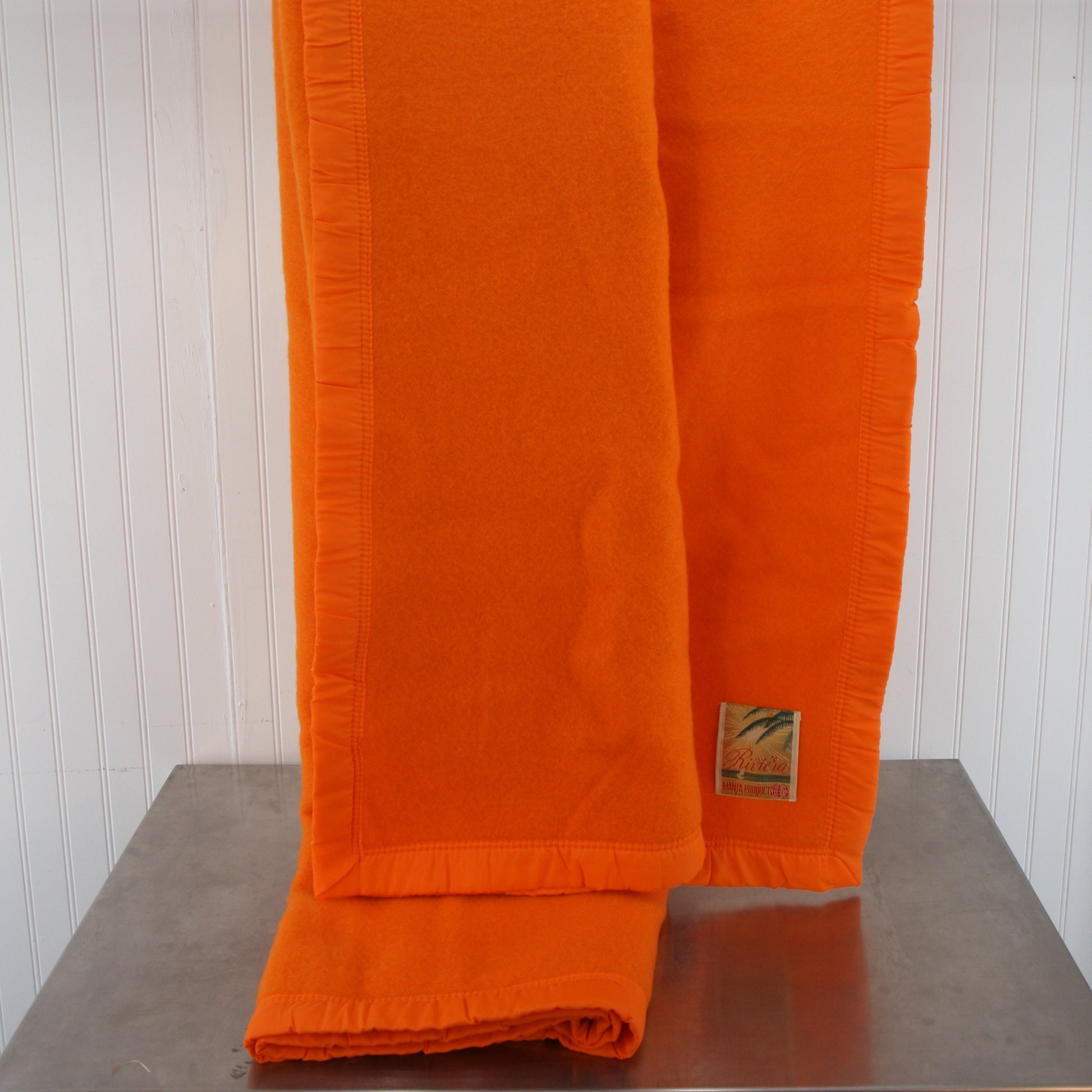 Folded Riviera Manta Acrylic Orange Blanket Extended View