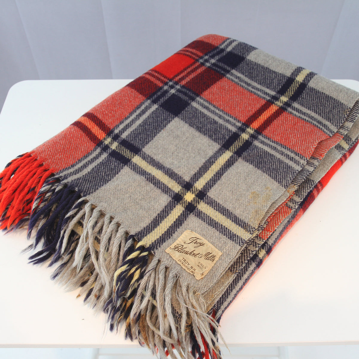 Vintage Troy Plaid Fringed Wool Cabin Camp Blanket 54W x 66L. Has the traditional feel and smell of wool.