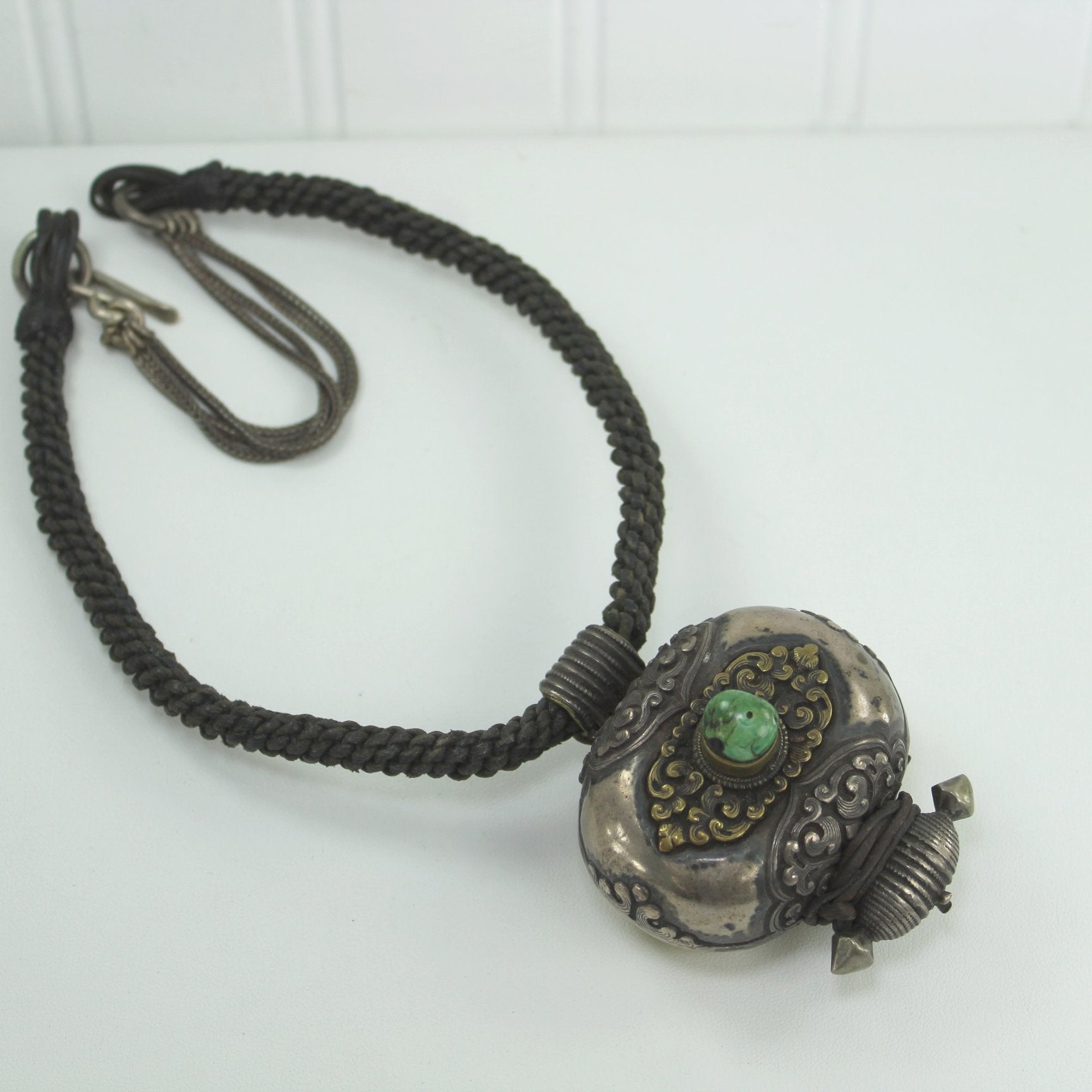 Vintage Tibetan Necklace Prayer Box Gau Green Turquoise Silver Brass flat on table view