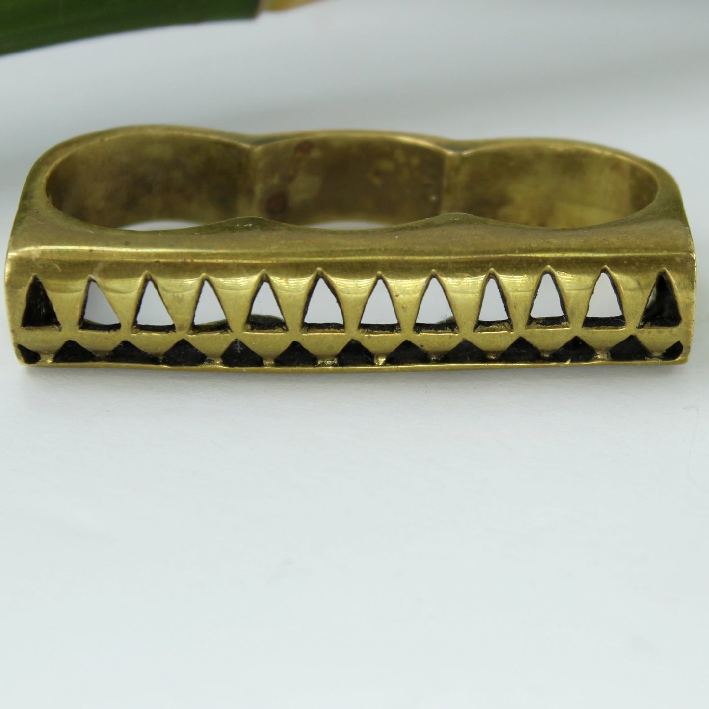 Eleven44 Brass 3 Finger Ring Repeat Open Triangle Pattern front view of ring face