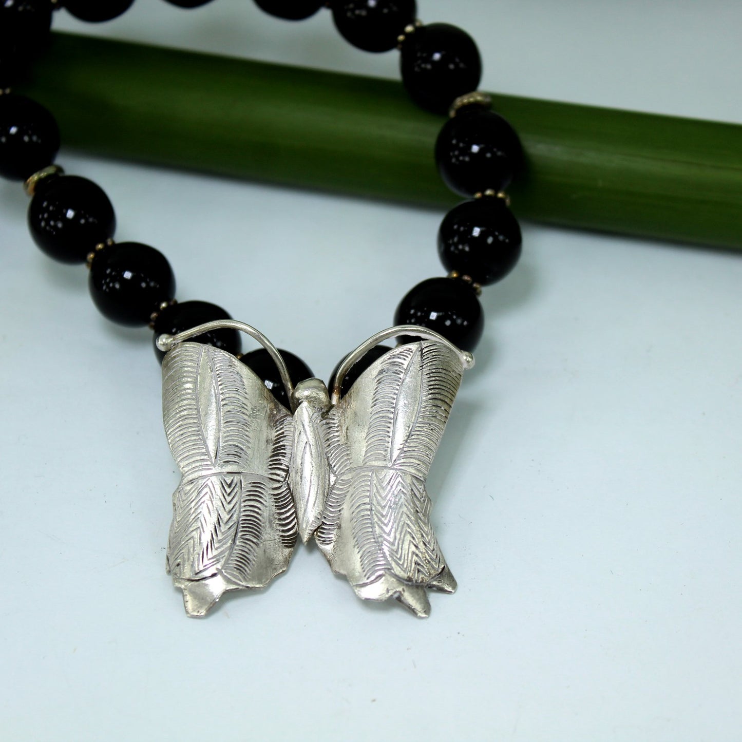 EF Silver Butterfly Black Bead Necklace closeup butterfly