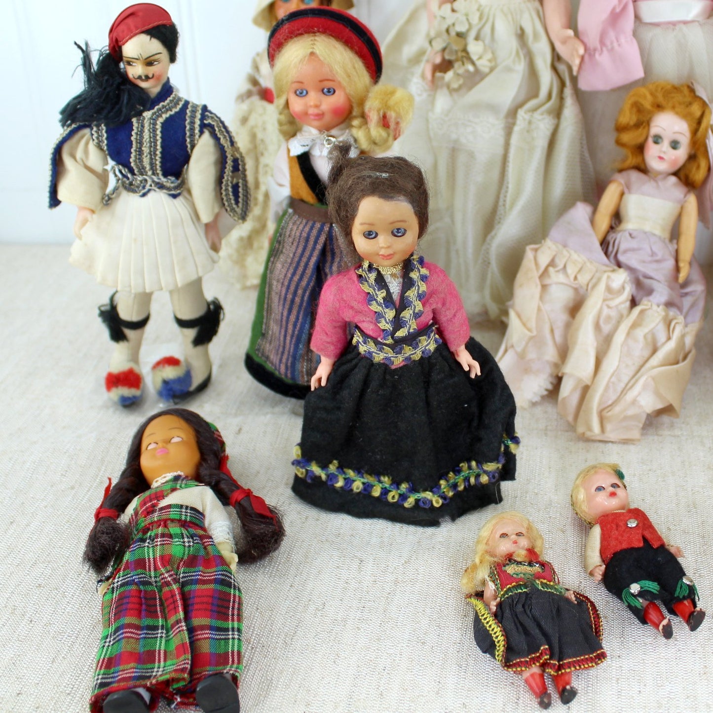 Collection 16 Vtg Small Dolls International Brides Seminole Porcelain Vinyl Fabric eastern euro dolls