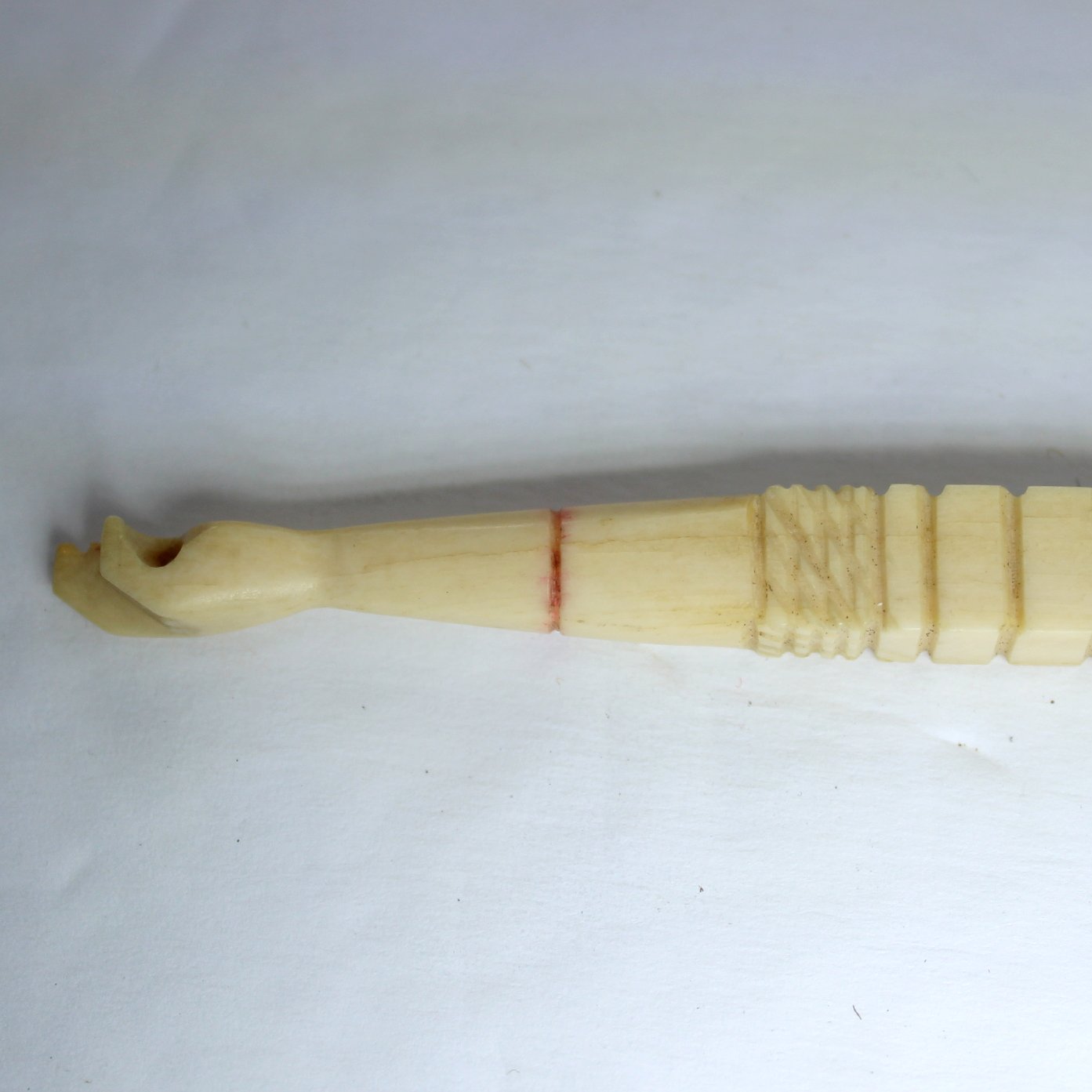 Exquisite Collectible Antique Bone Ivory Crochet Hook Carved Hand Top Decorated Handle view of material closeup