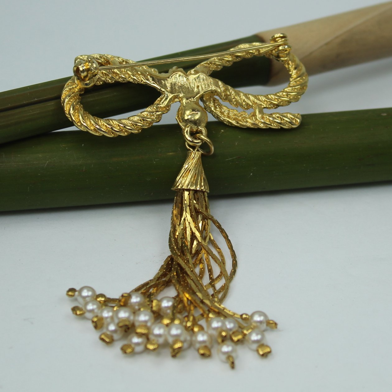 Gold Bow Pin Pearl Long Chain Tassel Designer Quality reverse of pin