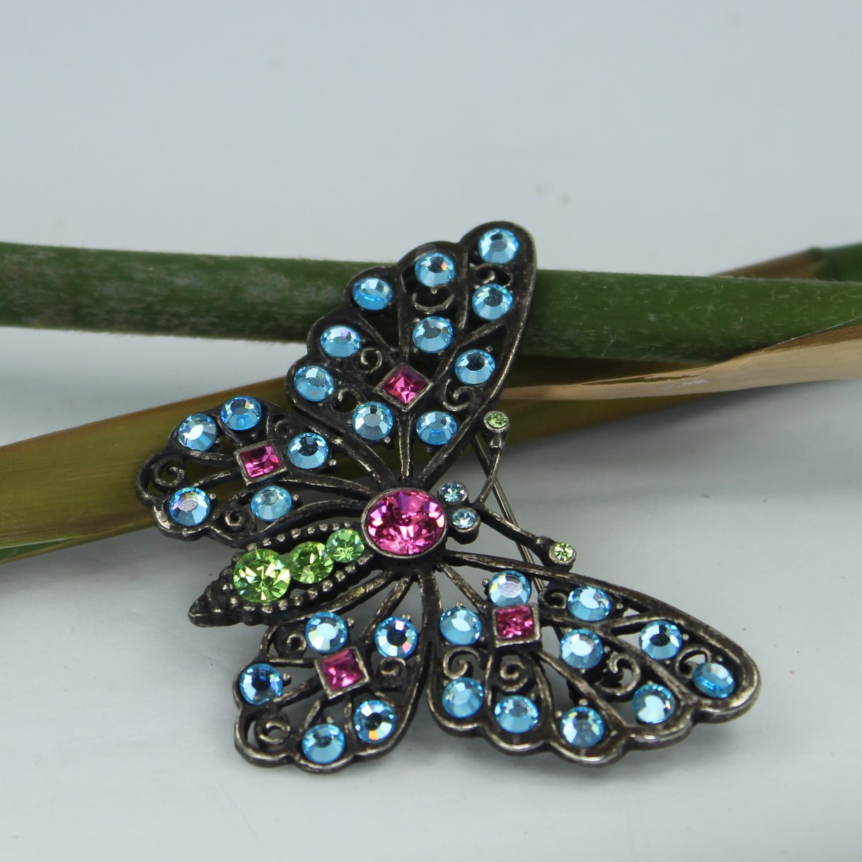 Brilliant Crystal Butterfly Pin Pewter Finish Blues Green Bright Pink Sparkling side view pin