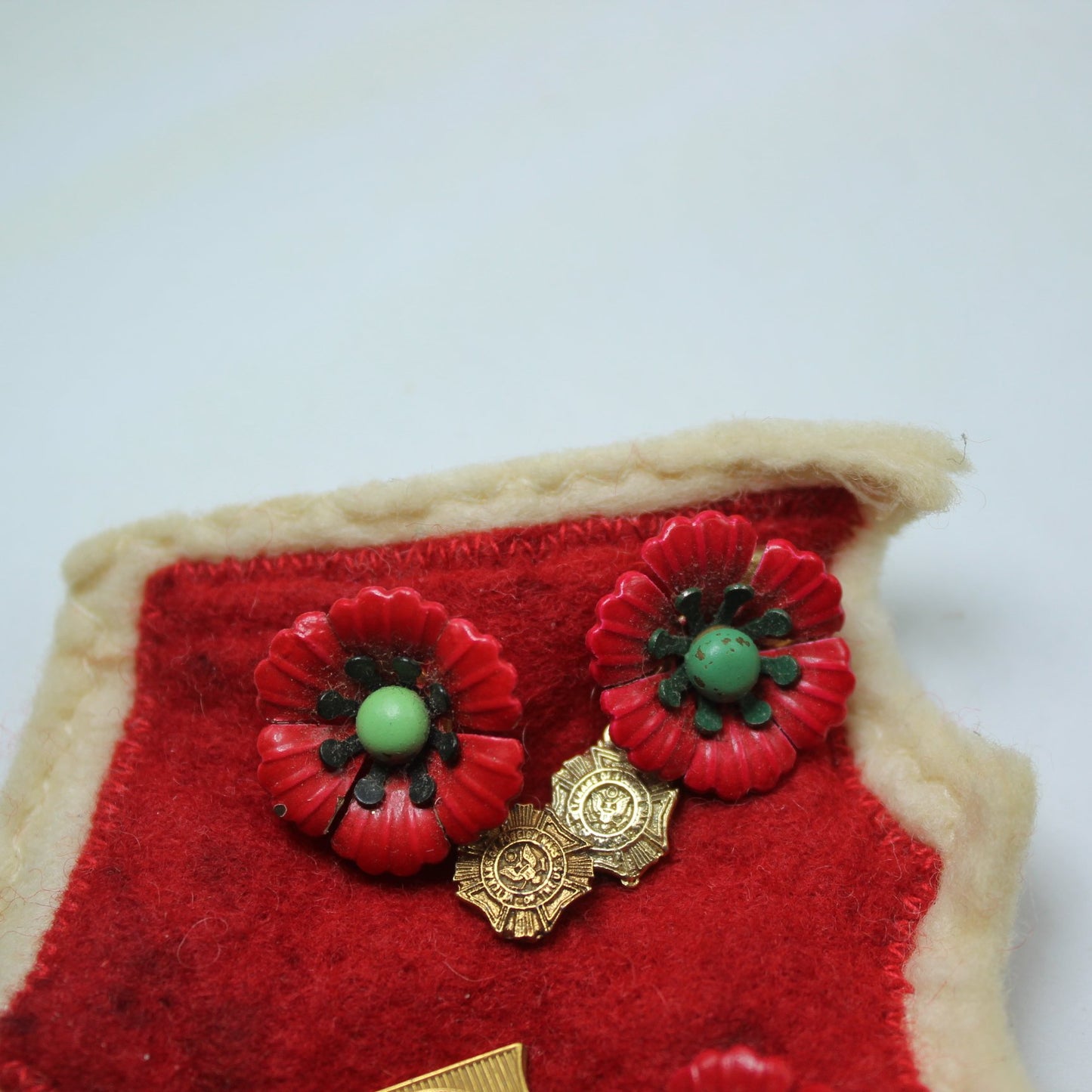 Collection Vtg Military Order Cootie Aux and VFW Poppies Medals Red Felt Patch Cootie Pin closeup poppies