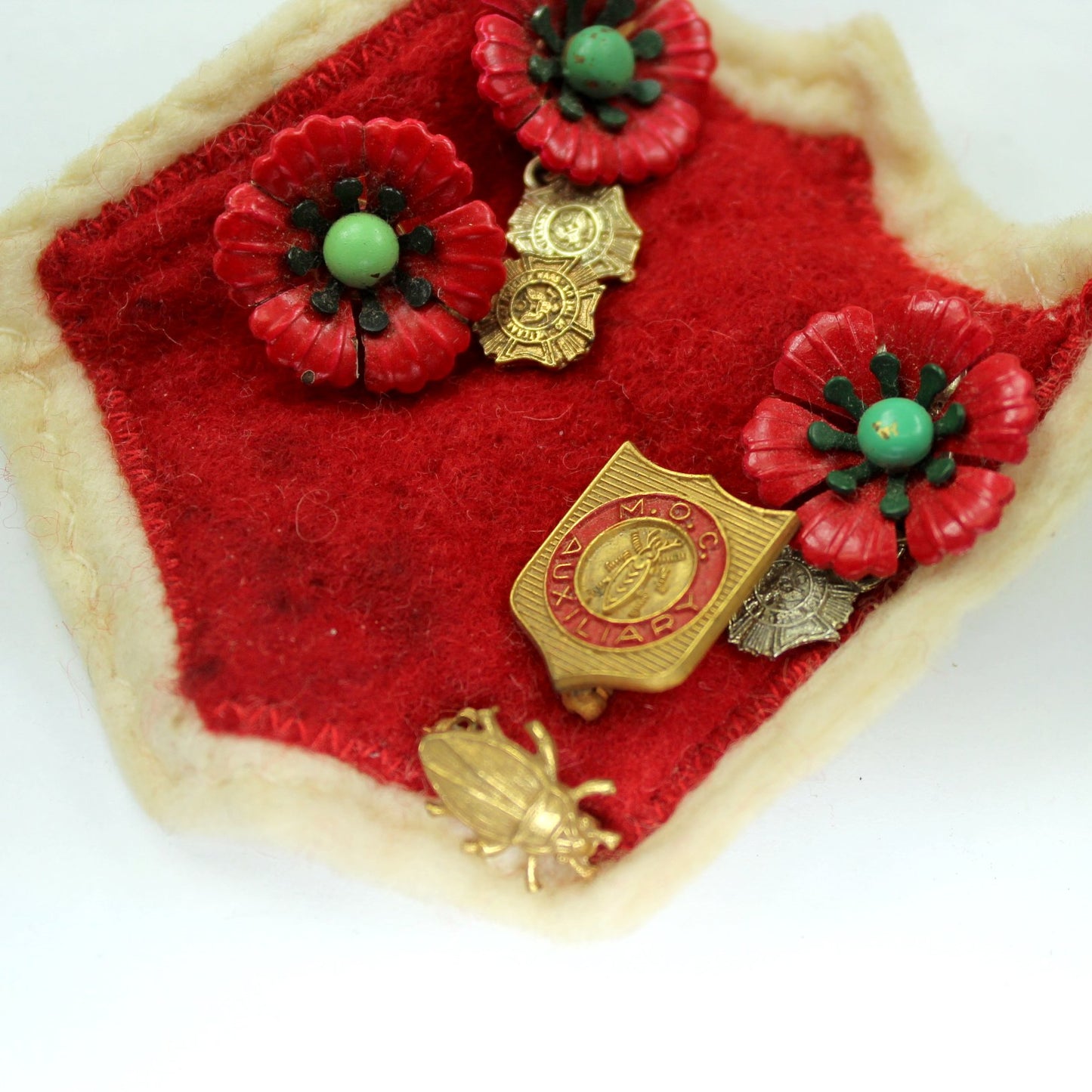 Collection Vtg Military Order Cootie Aux and VFW Poppies Medals Red Felt Patch Cootie Pin close view