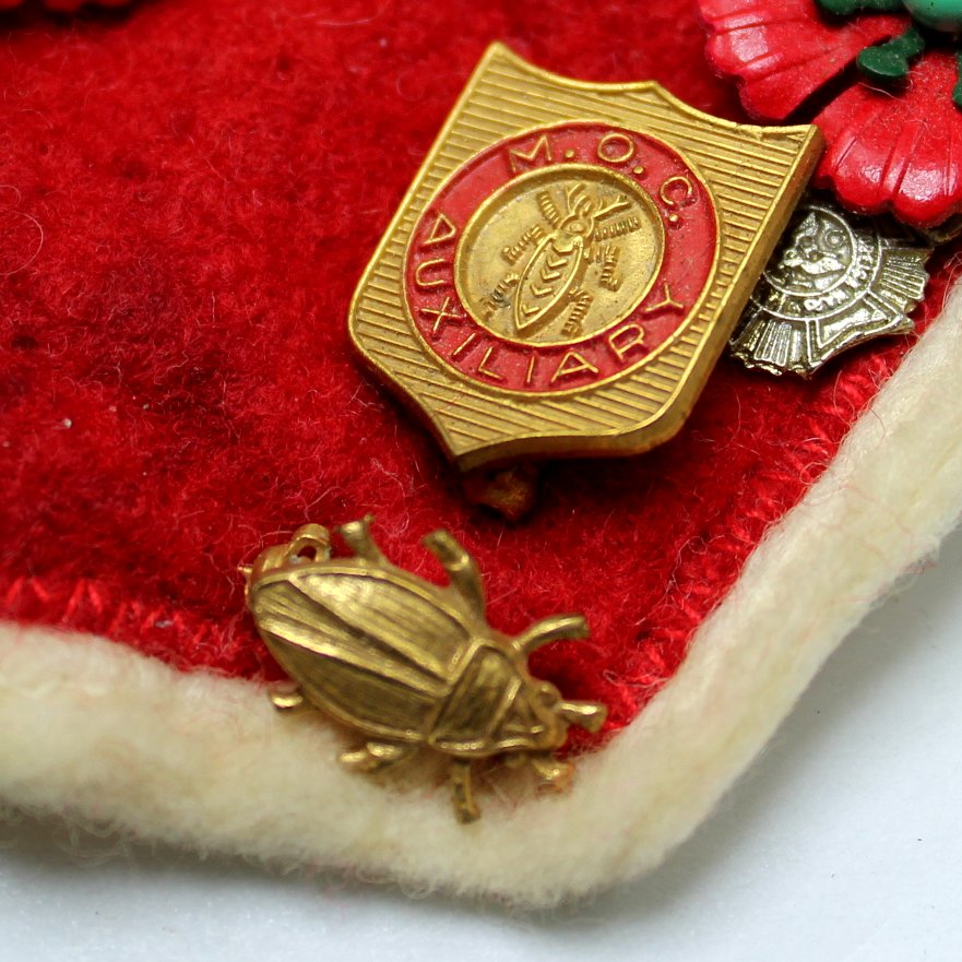 Collection Vtg Military Order Cootie Aux and VFW Poppies Medals Red Felt Patch Cootie Pin closeup cootie pin medal aux