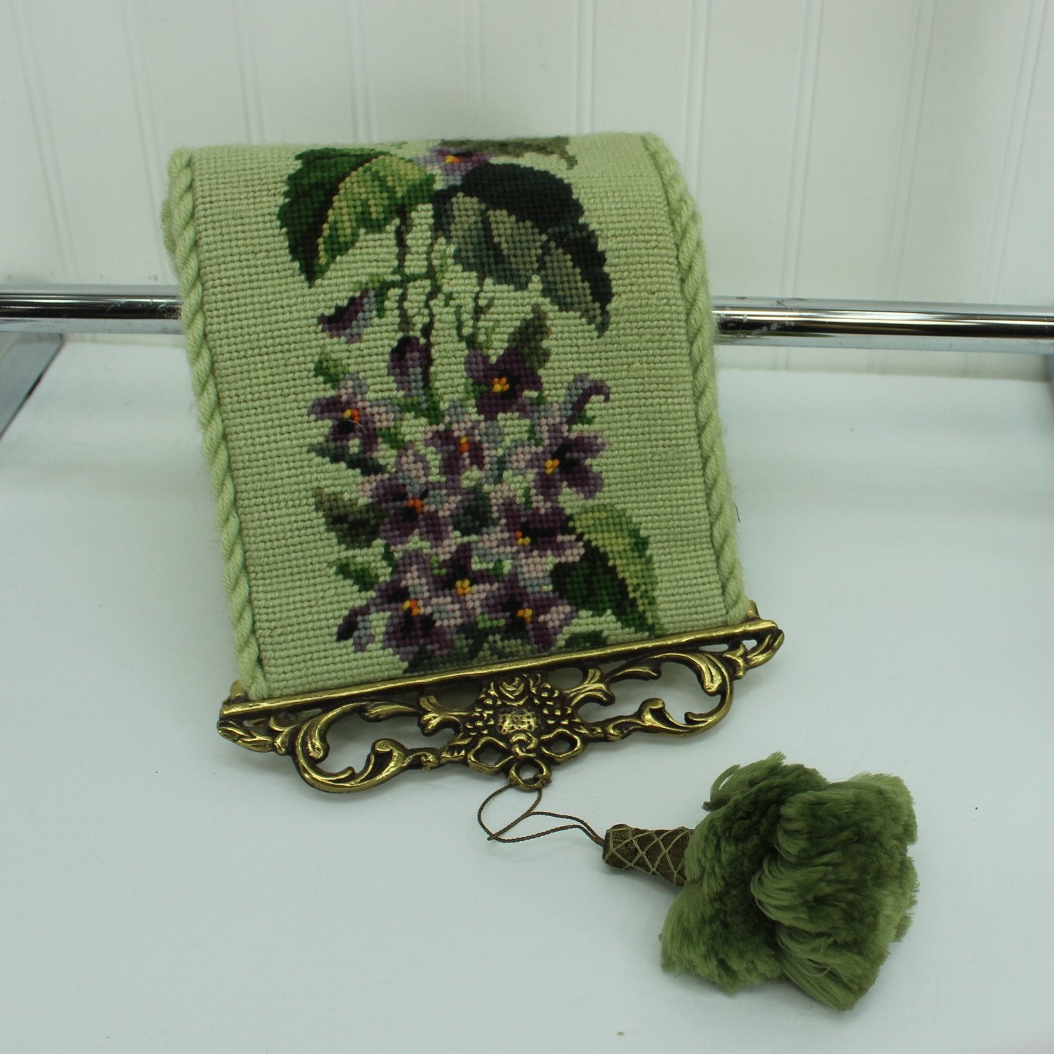 Needlepoint Bell Pull Violets Design Green Background Rope Edge Satin Lining Metal Filigree Ends close end and tassel
