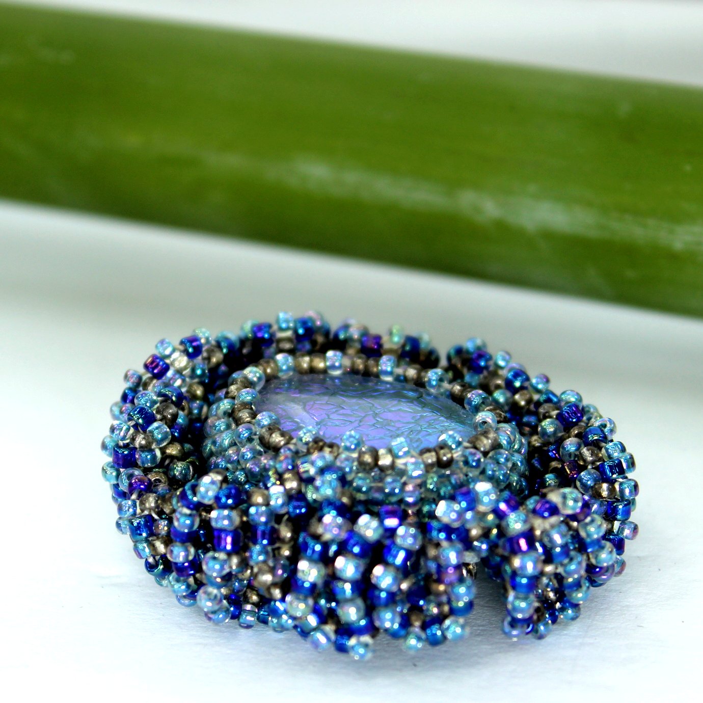 Pat Falk Early Work Glass Pin Iridescent Bead Ruffle Surround Brilliant Blues side and top glass view