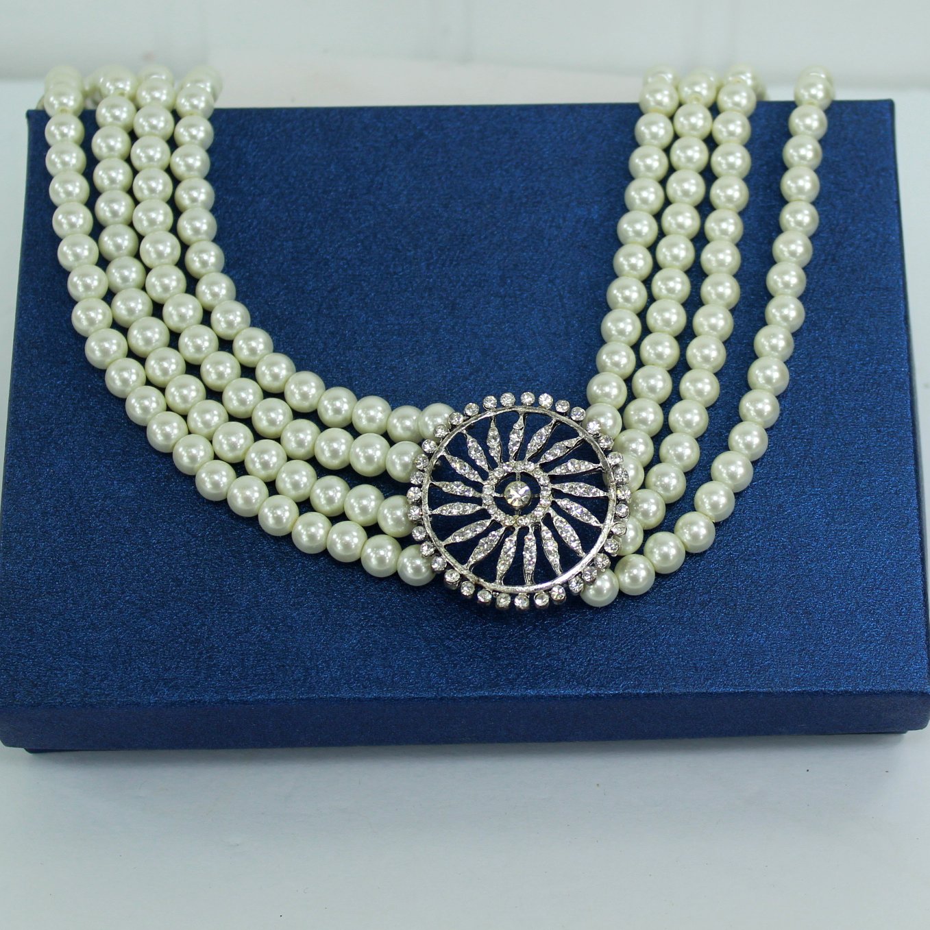 High Fashion Choker 4 Strand Pearl Necklace Large Sparkling Medallion Focal shown on blue gift box