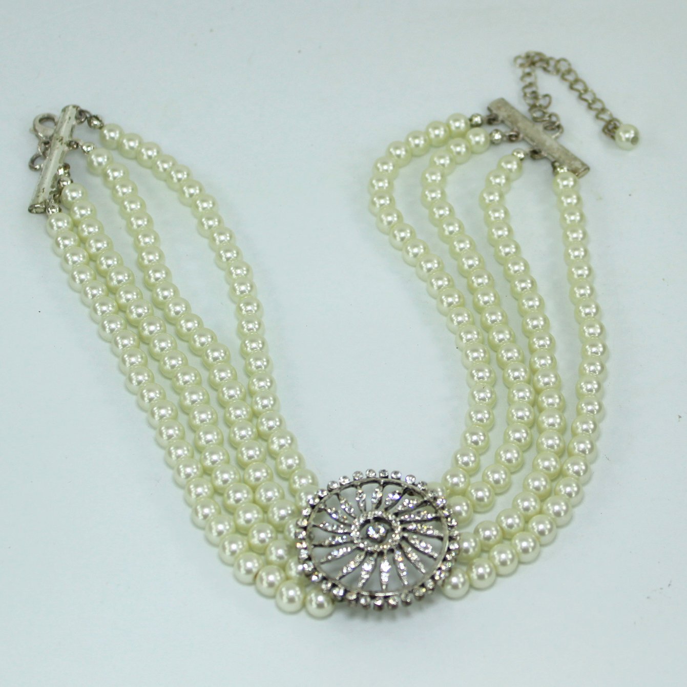 High Fashion Choker 4 Strand Pearl Necklace Large Sparkling Medallion Focal table view