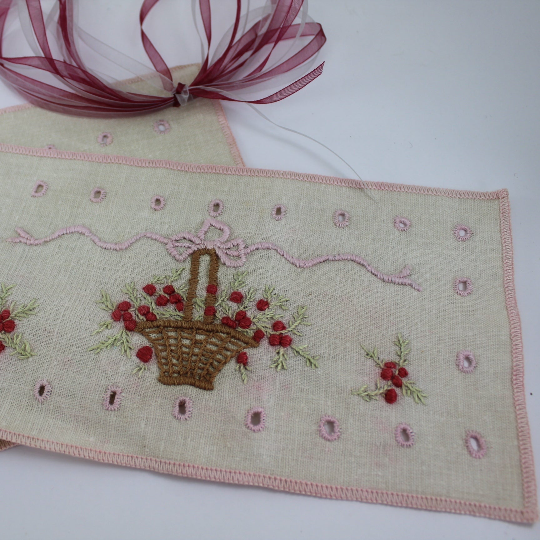 Small Intricately Embroidered Pillow Case Pin Cushion Sachet closeup of basket ribbon design