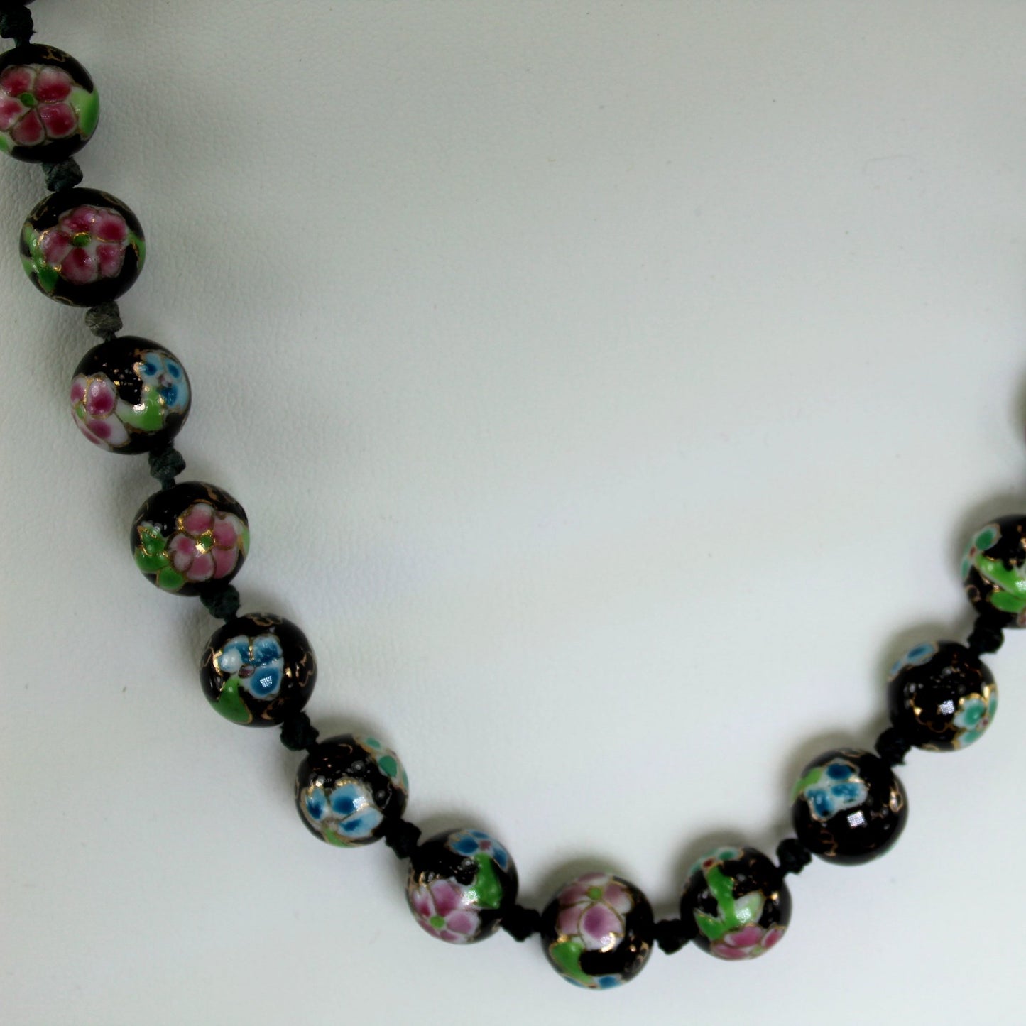Older Cloisonne Hand Knotted Necklace 42 Beads 11mm Black Pink Blue closeup of beads