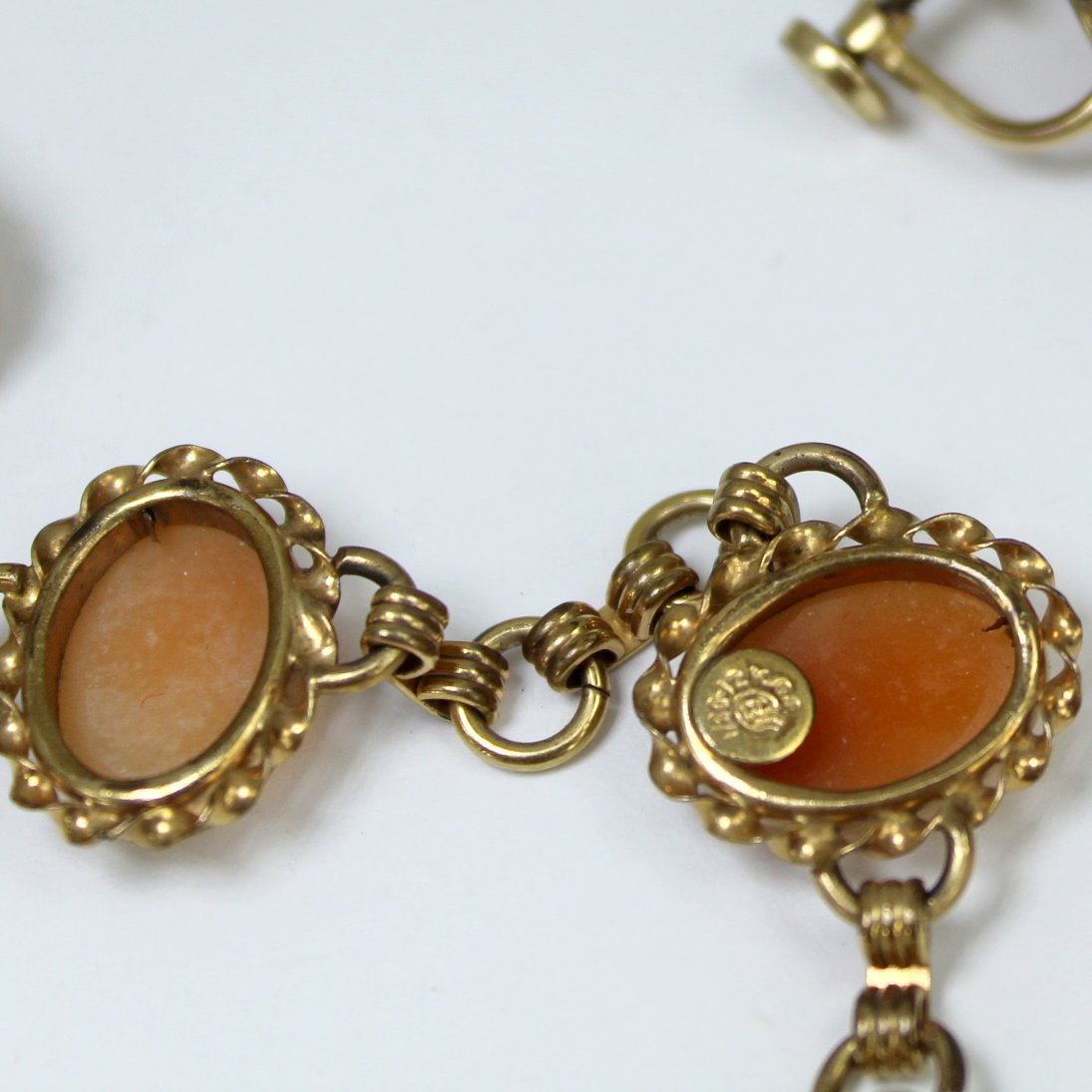 Matching Set CC Curtman Link Cameo Bracelet Earrings 1950s Uncas closeup of maker CC hand holding ball with CC initials