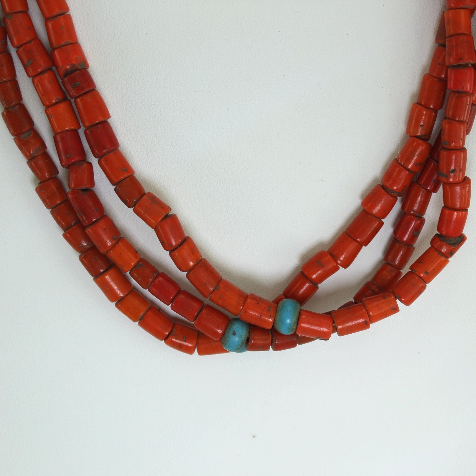 African Necklace Coral Beads Blue Glass Beads Old Coin Closure closeup of beads