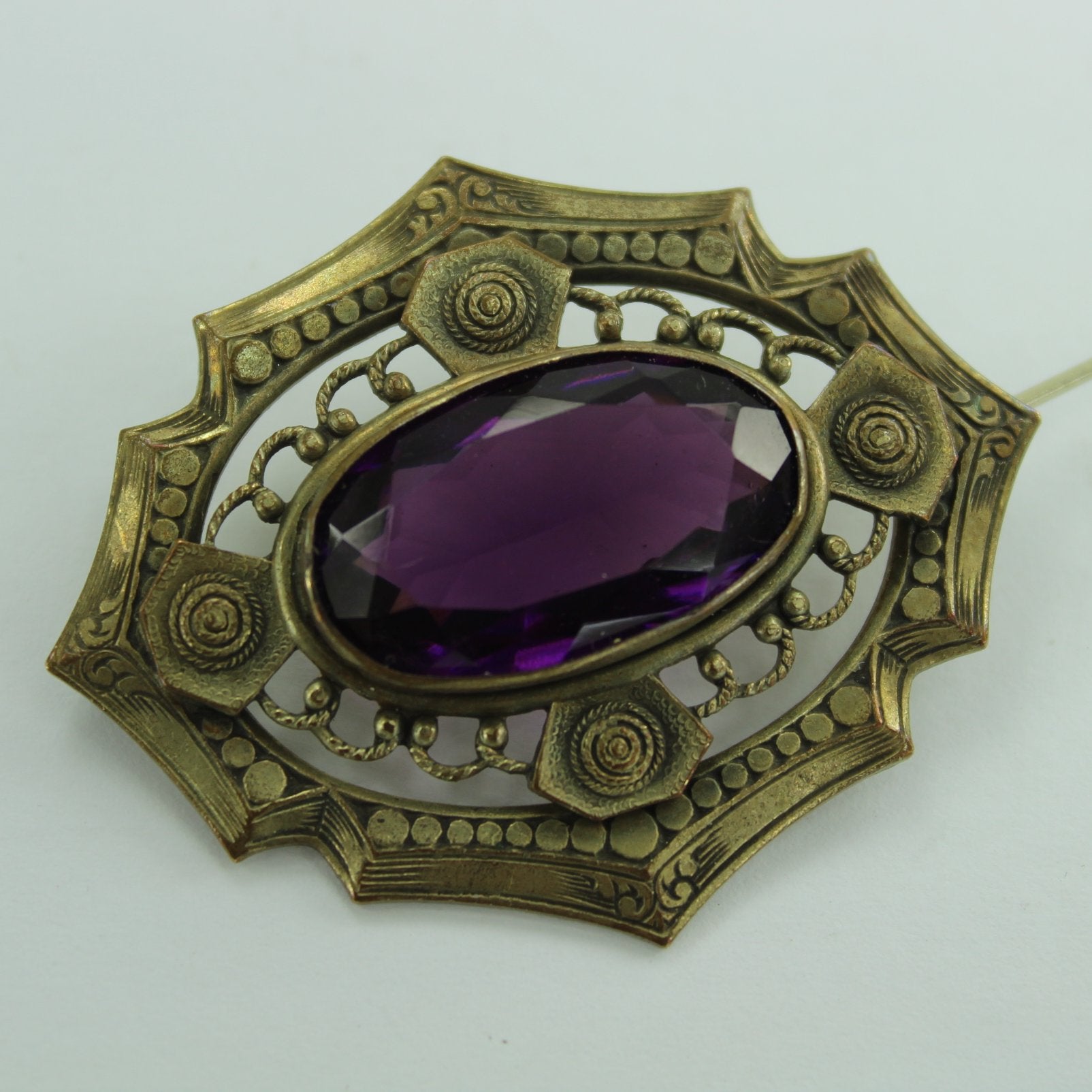 Old Faceted Amethyst Pin Intricate Surround C Closure closeup of pin