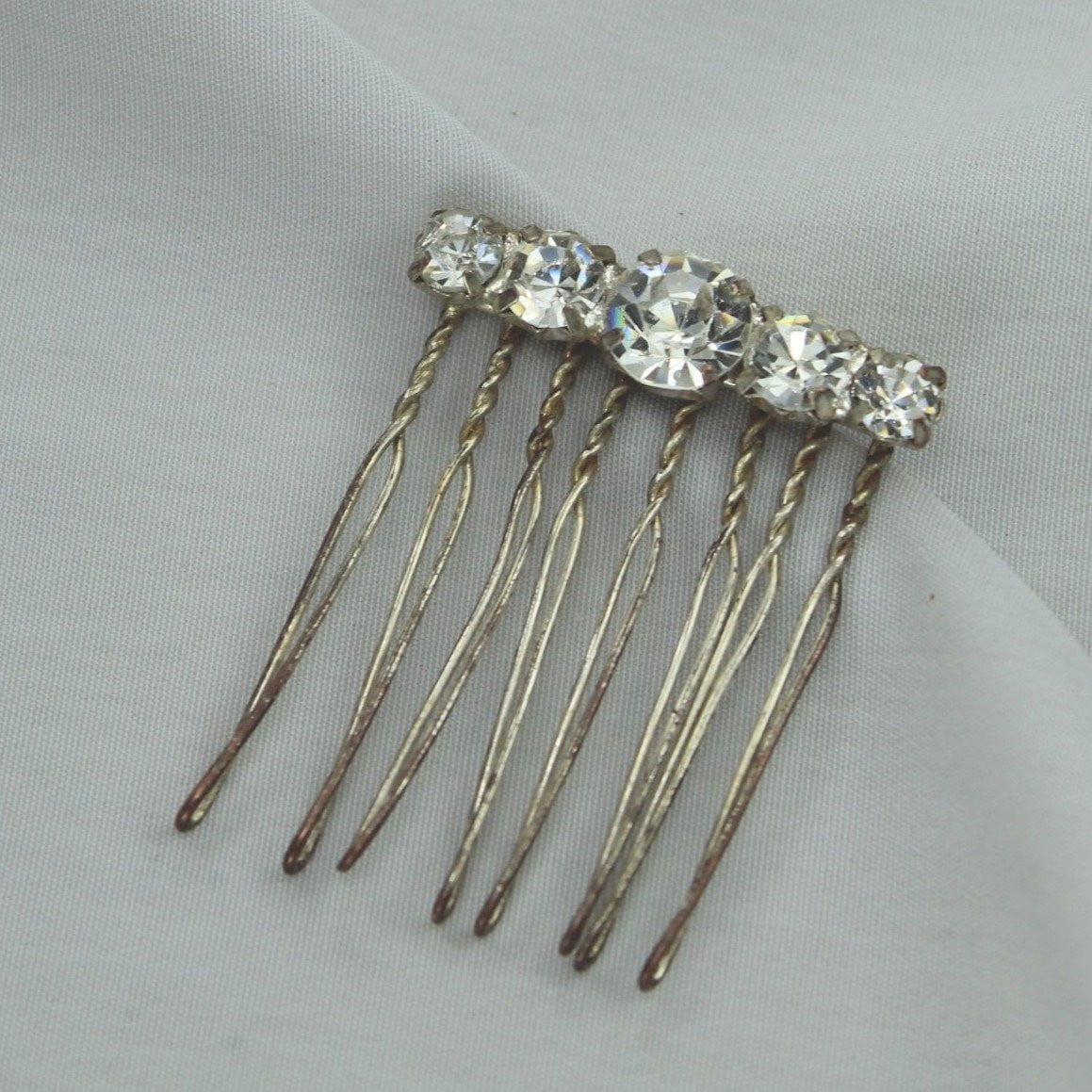 Neat Vintage Antique Hair Pin Decoration. Metal hair pin like base with large shiny Rhinestones. Metal shows vintage Stones great!  Fun piece. Wear