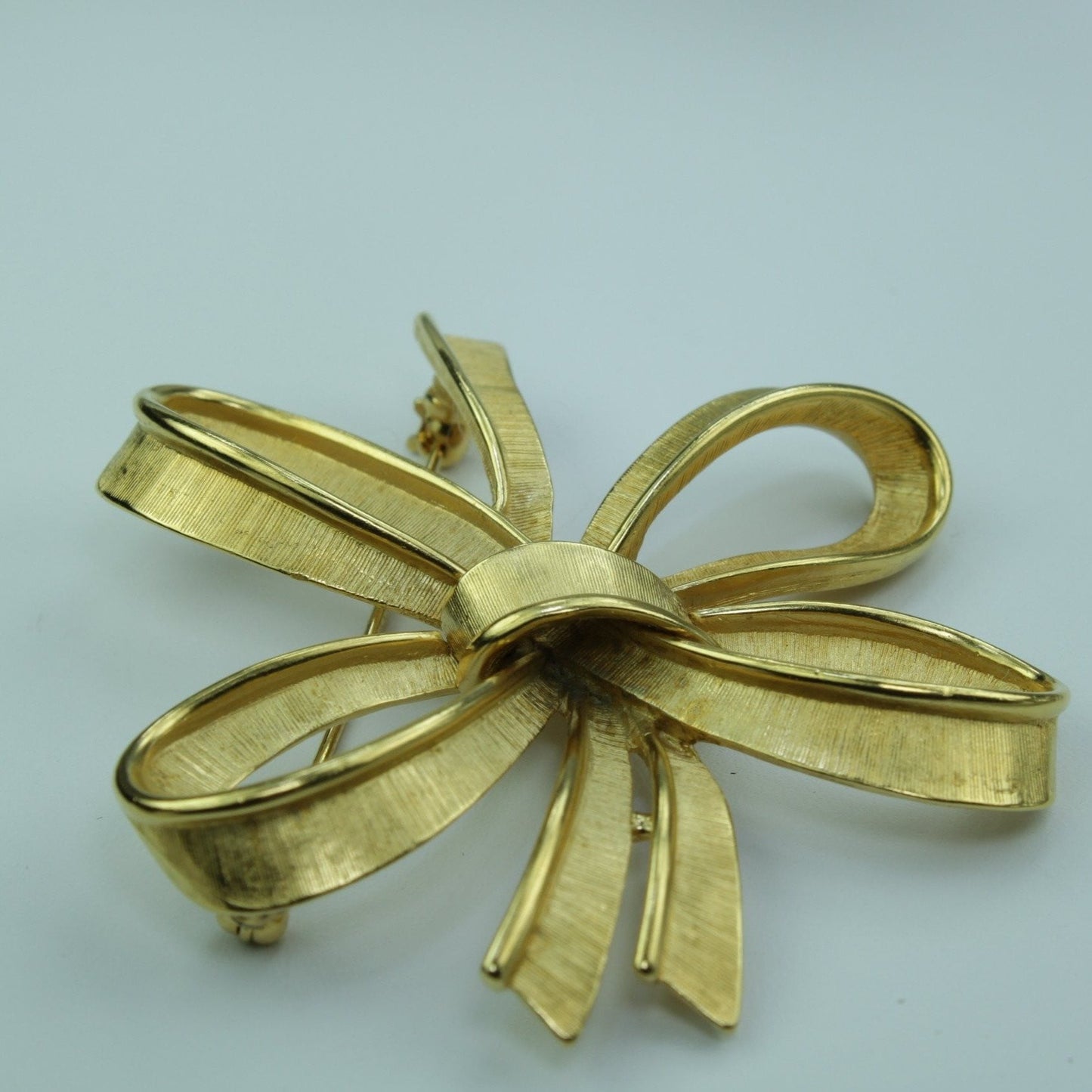 Vintage MONET Pin Gold Free Form Stylized Bow Mid Century brushed